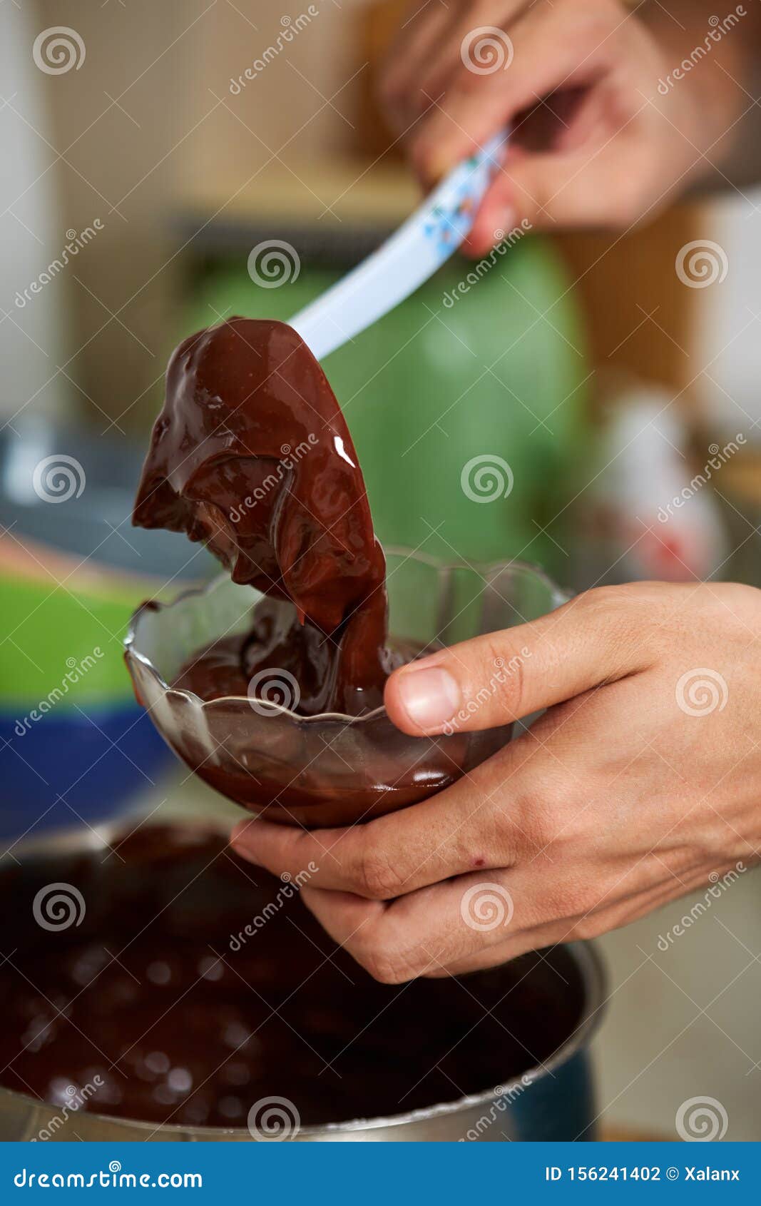 Preparing Homemade Chocolate Pudding, Closeup on Hands Stock Photo