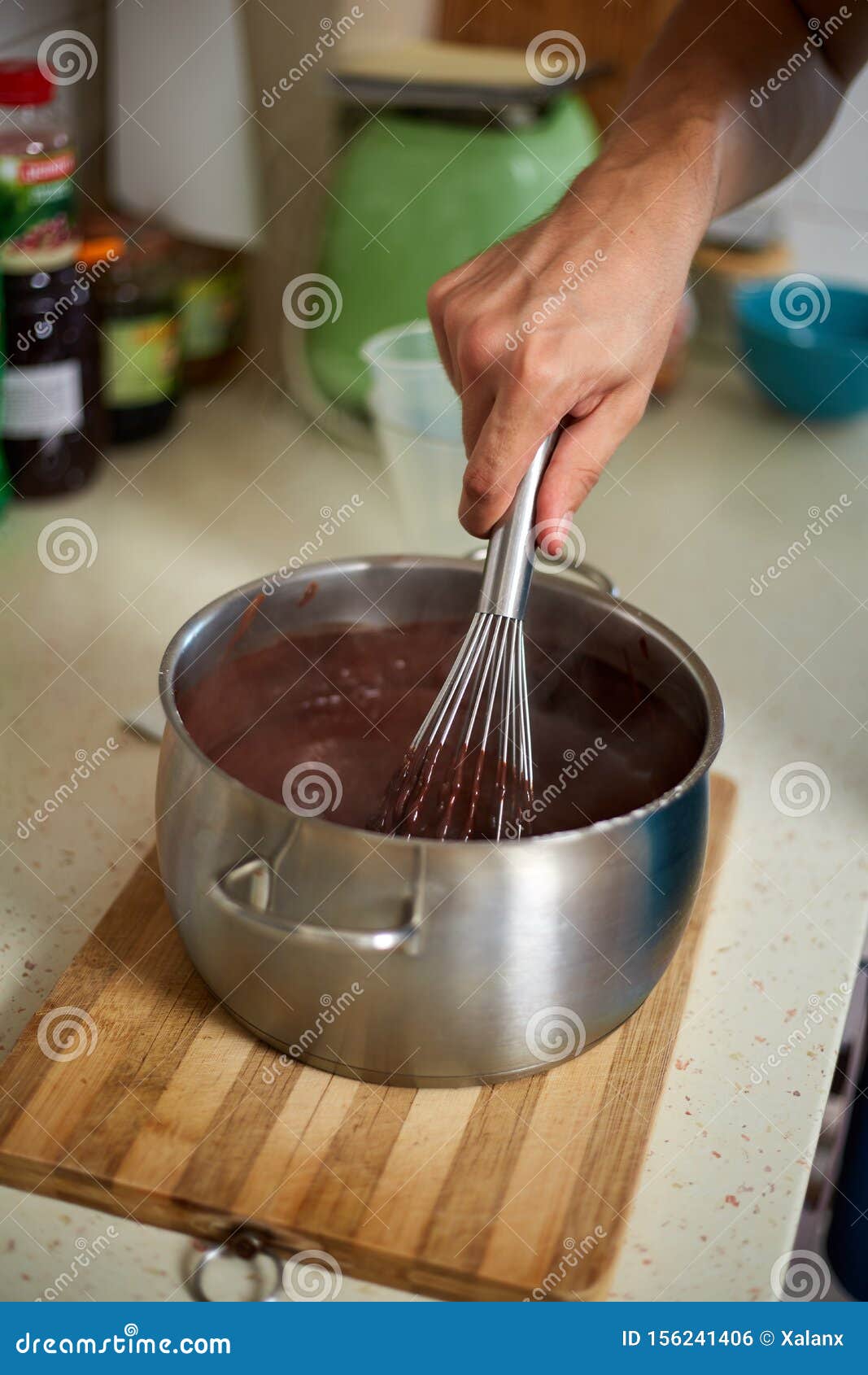 Preparing Homemade Chocolate Pudding, Closeup on Hands Stock Photo