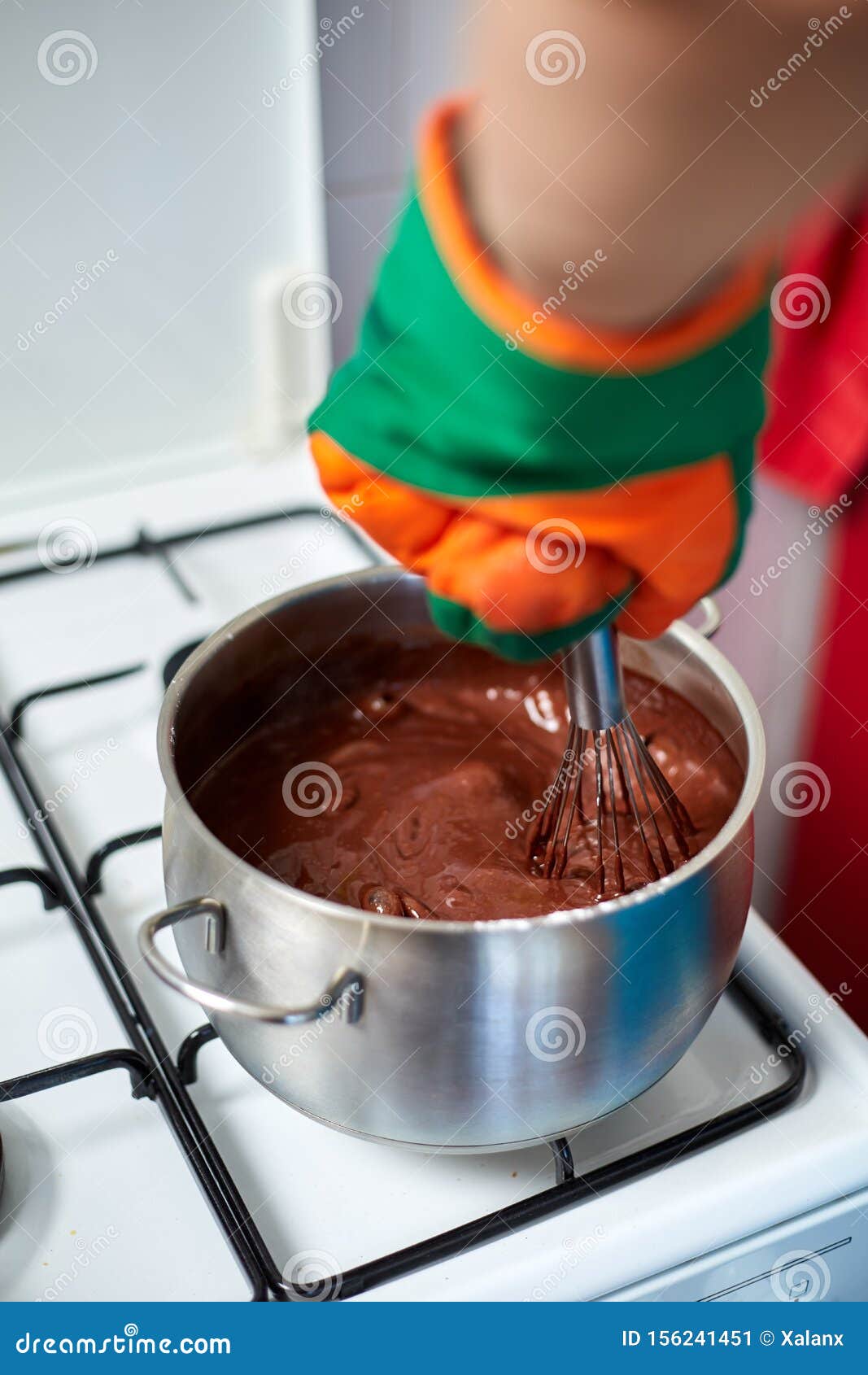 Preparing Homemade Chocolate Pudding, Closeup on Hands Stock Image
