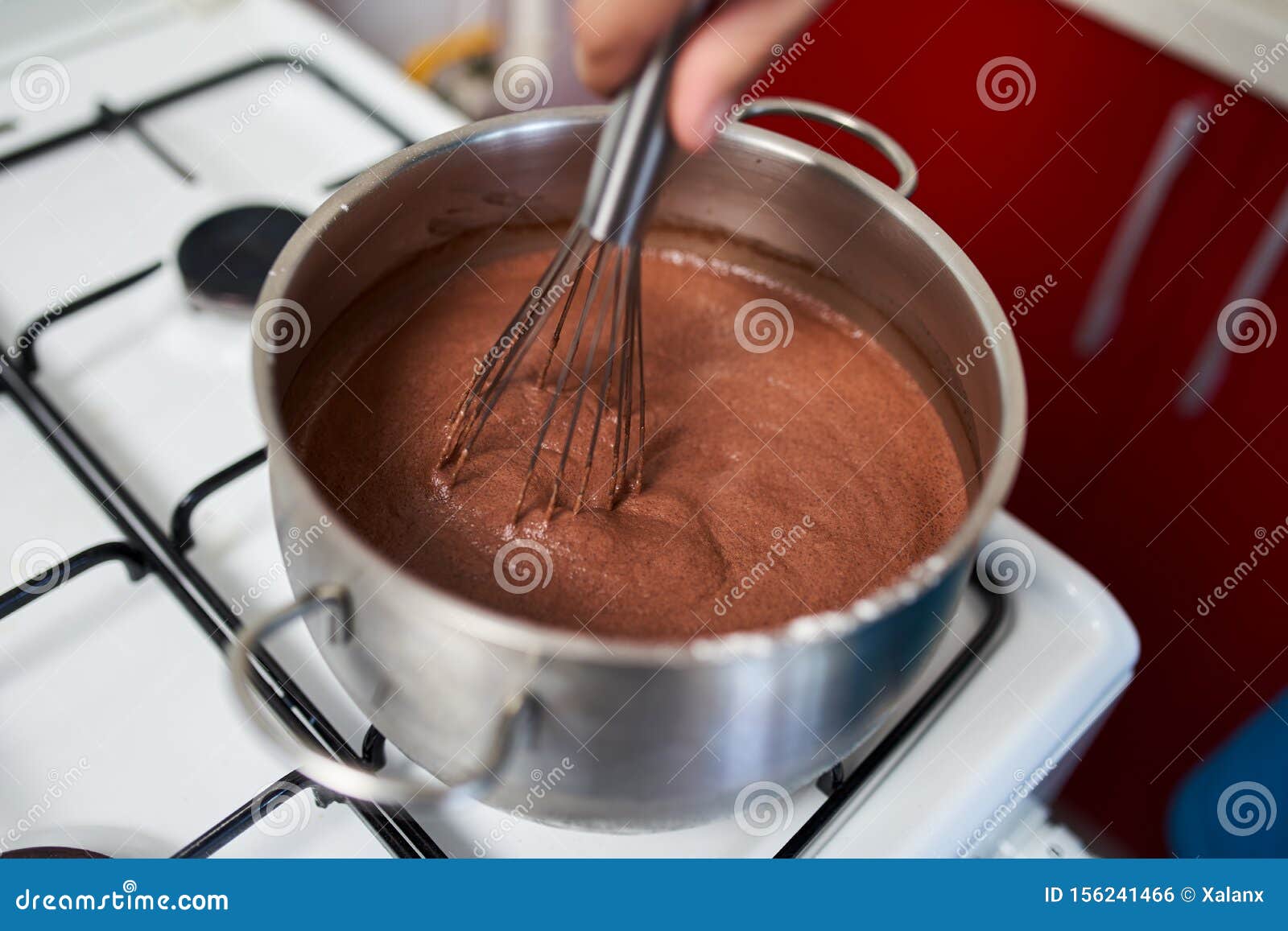 Preparing Homemade Chocolate Pudding, Closeup on Hands Stock Photo