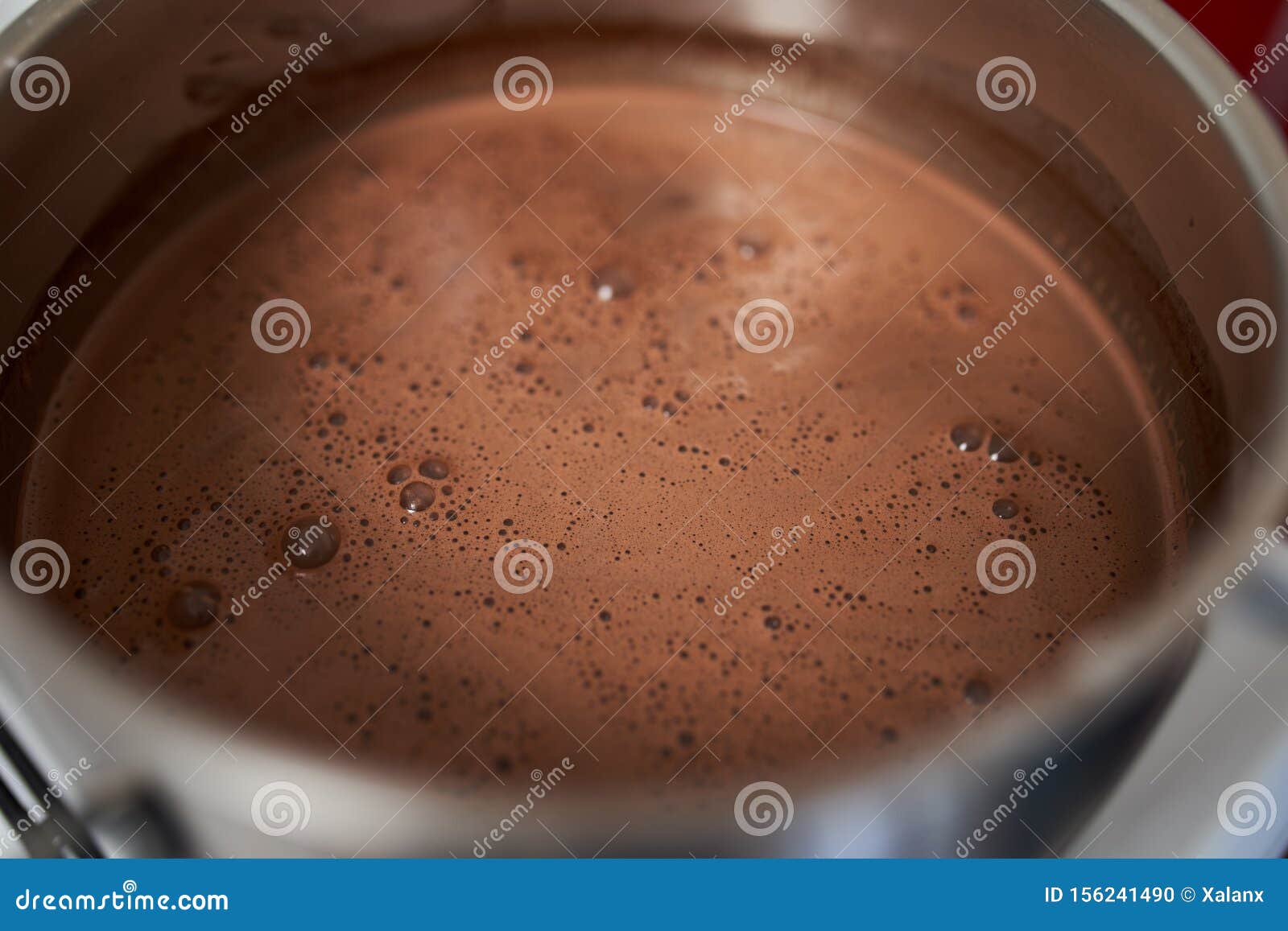 Preparing Homemade Chocolate Pudding, Closeup on Hands Stock Photo