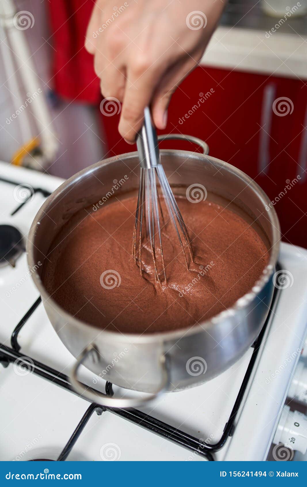 Preparing Homemade Chocolate Pudding, Closeup on Hands Stock Photo