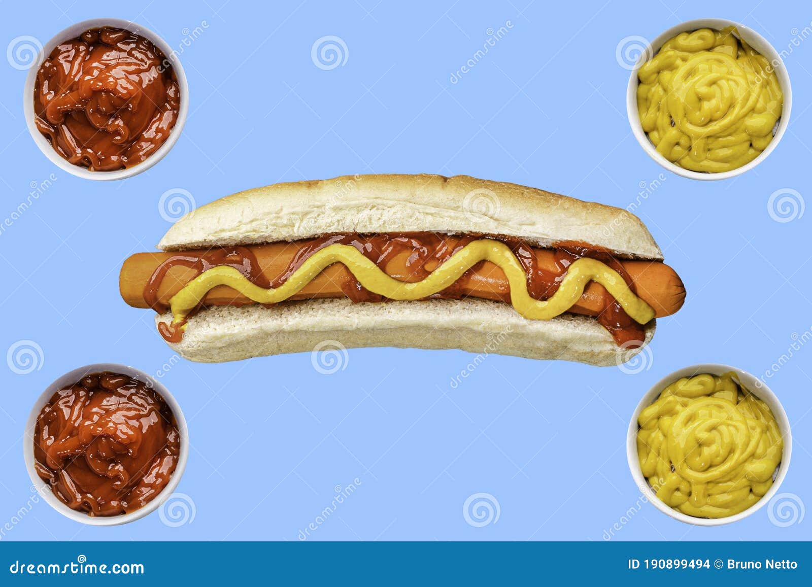 Preparing Hot Dogs with Ketchup and Mustard on White Bread Stock Photo