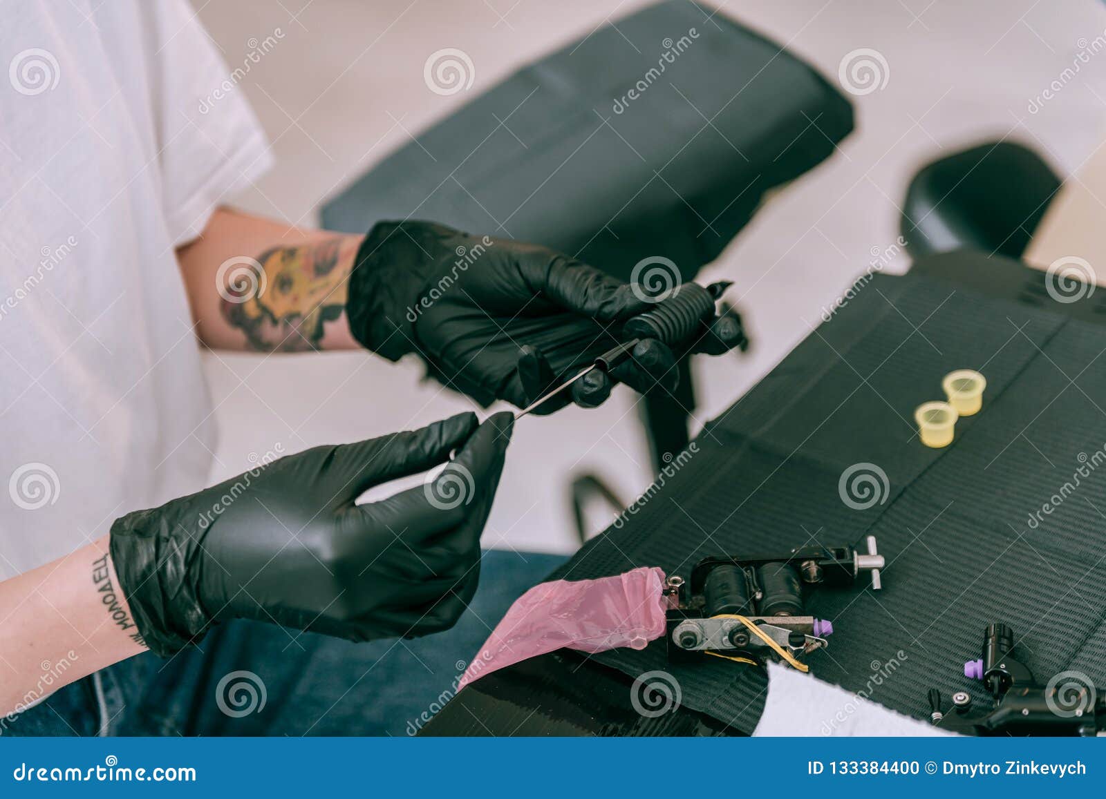 Professional Tattoo Master Setting Needle Inside of Tattoo Machine
