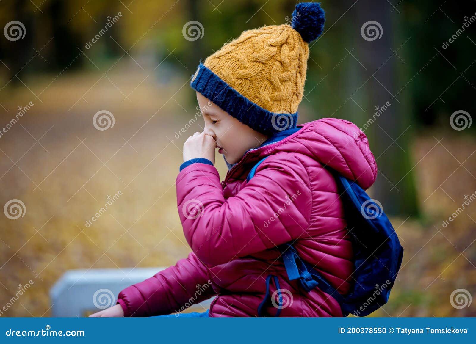 preschool child, boy, sneezing in park, flu season