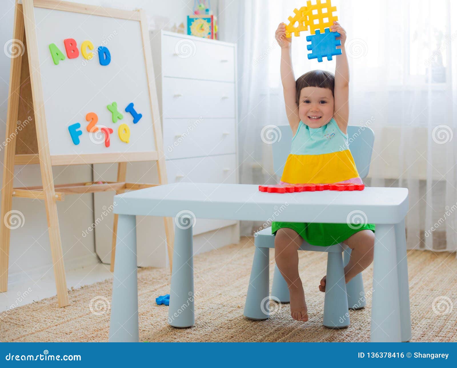preschool-child-3-years-playing-with-colorful-toy-blocks-stock-photo