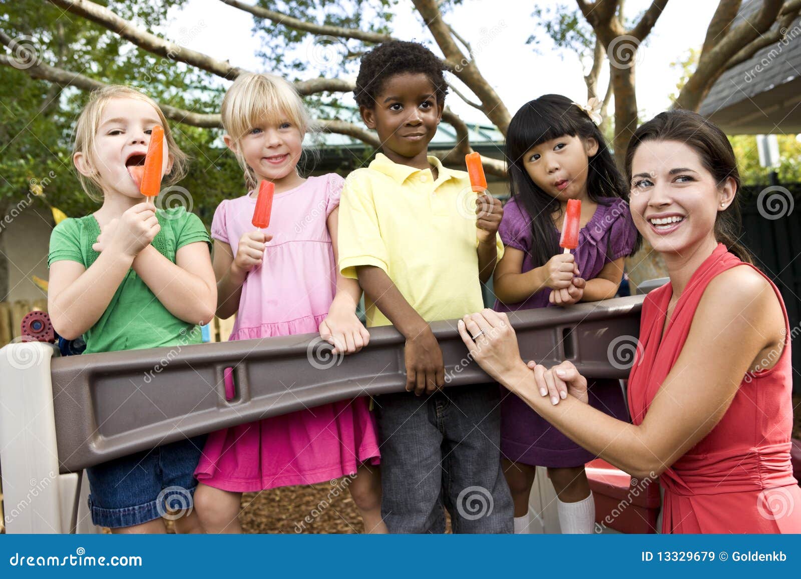 Preschool Children on Playground with Teacher Stock Image Image of