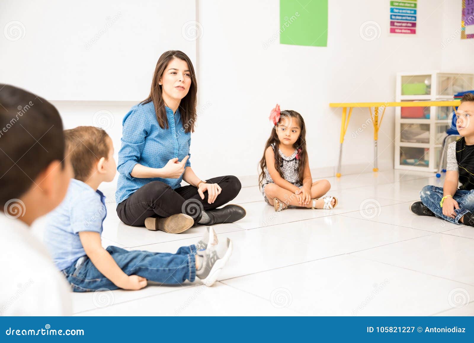 Preschool Teacher Sitting In The Floor Stock Image Image Of