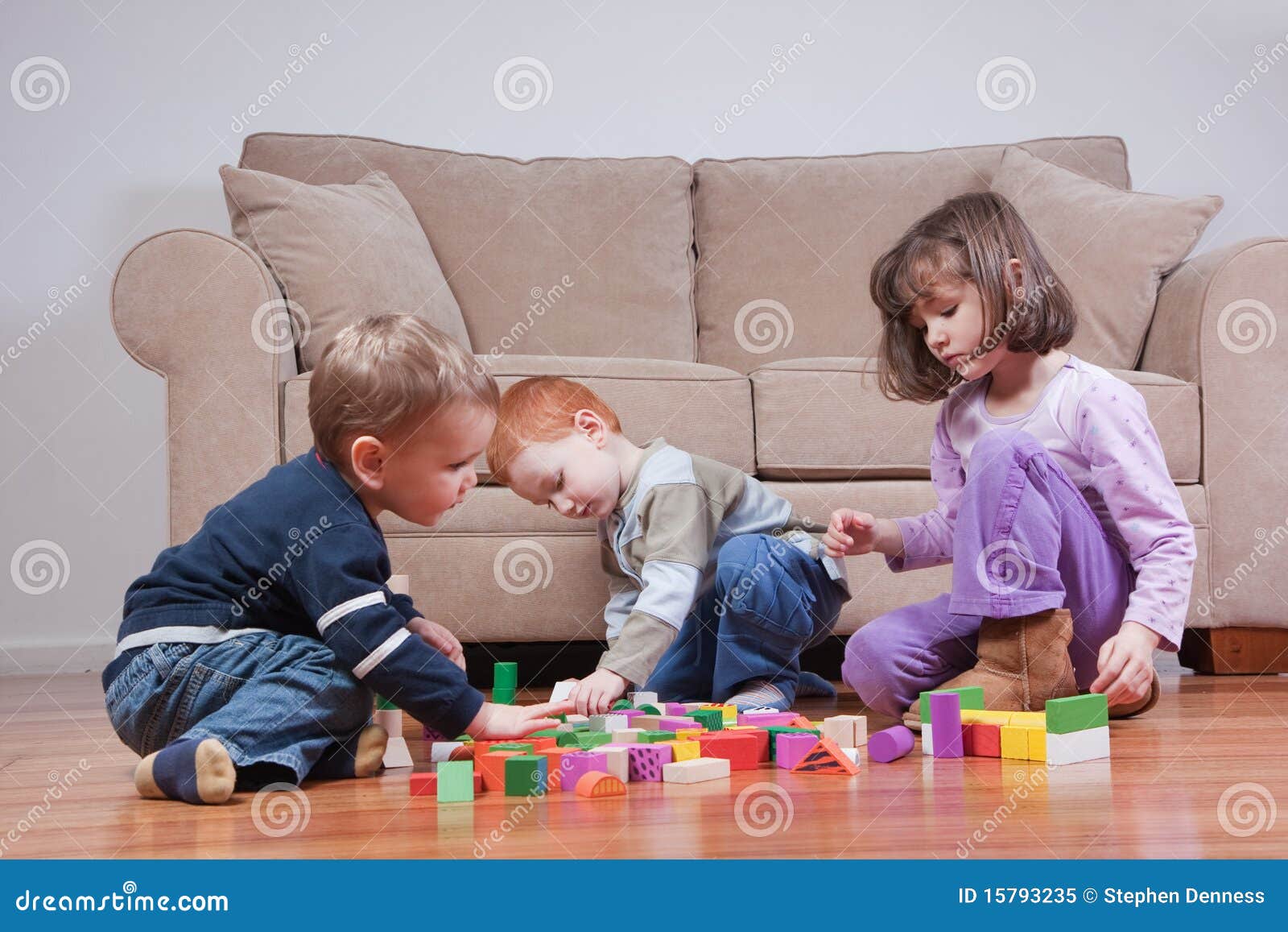 preschooler children playing with toy blocks