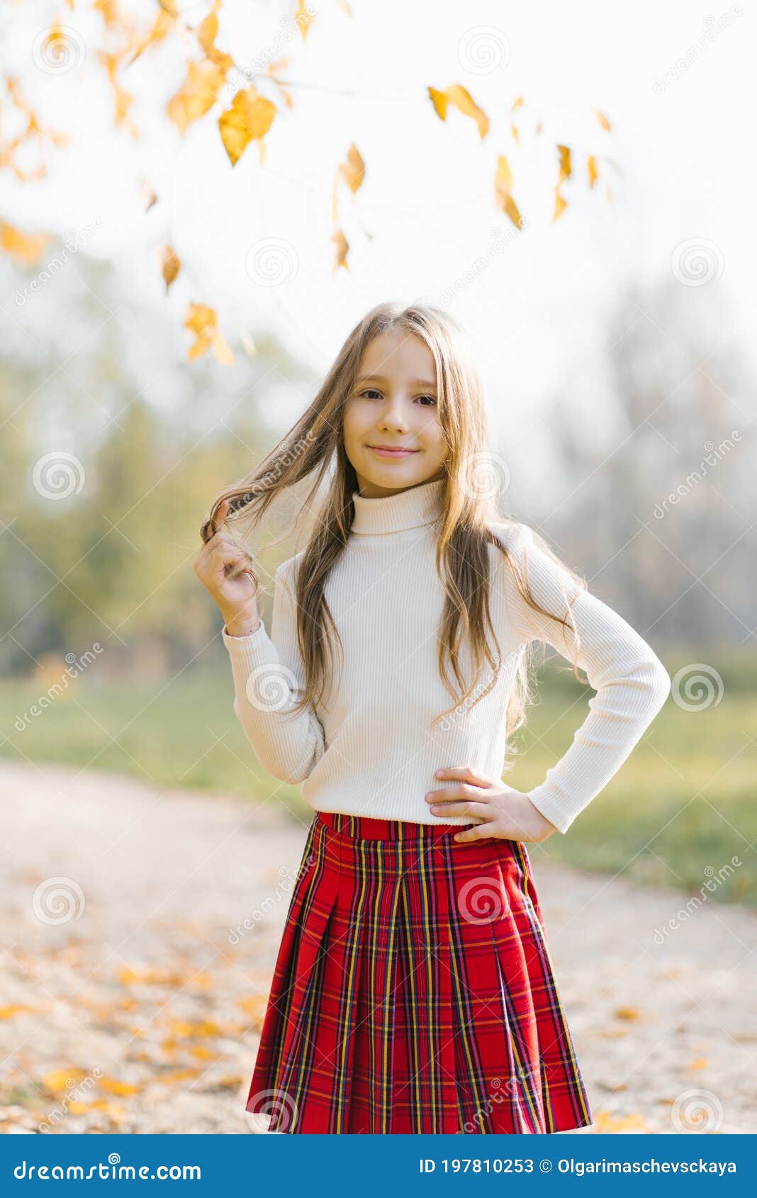 Preschooler Little Girl in a White Sweater and Red Plaid Skirt with ...