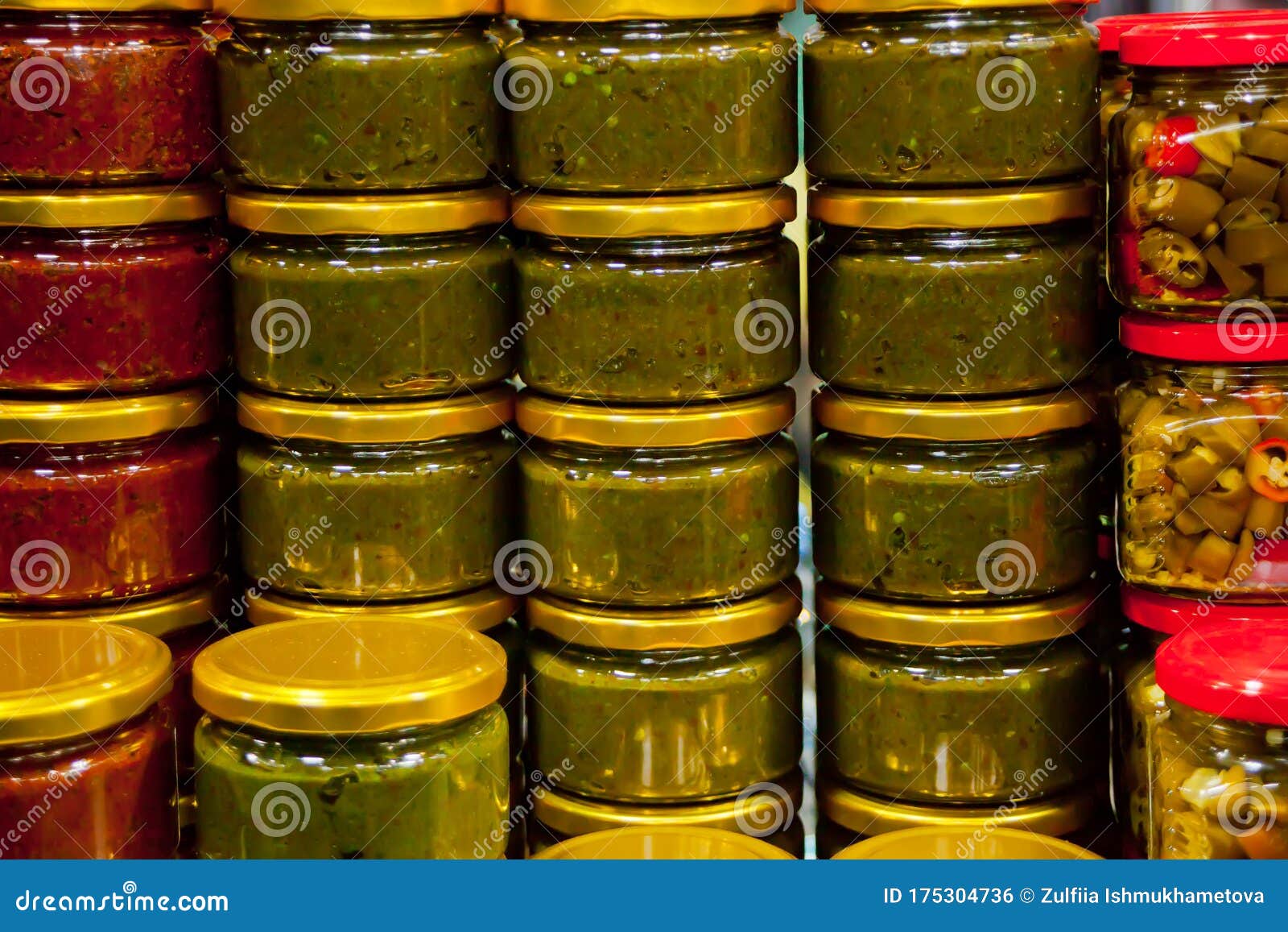 Preserved, Different Sauces in Glass Jars. Row of Sauces Jars Stock