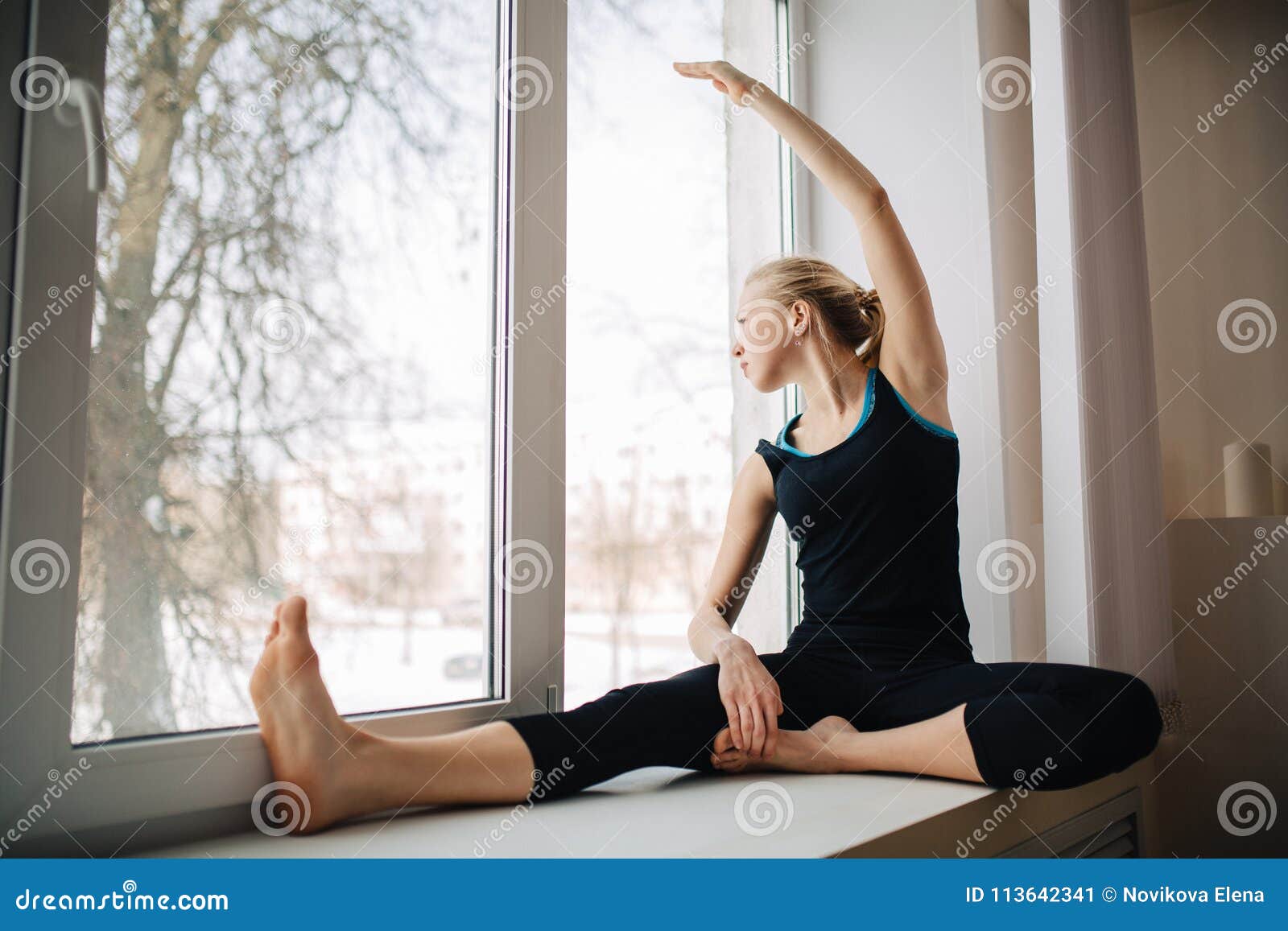Pretty Athletic Blonde Girl in Black Sportswear Sitting Near Window Looking Out. Fitness Concept. Stock - Image of holding, active: 113642341
