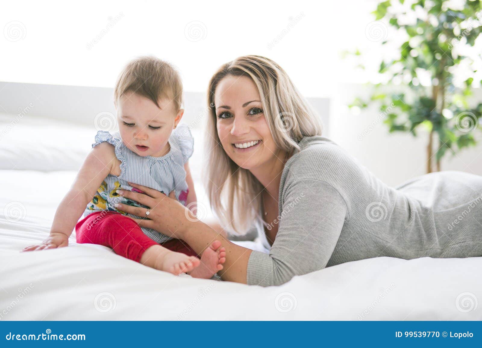 Pretty Baby Sit on Mom in Silk Bed Stock Photo - Image of caucasian ...