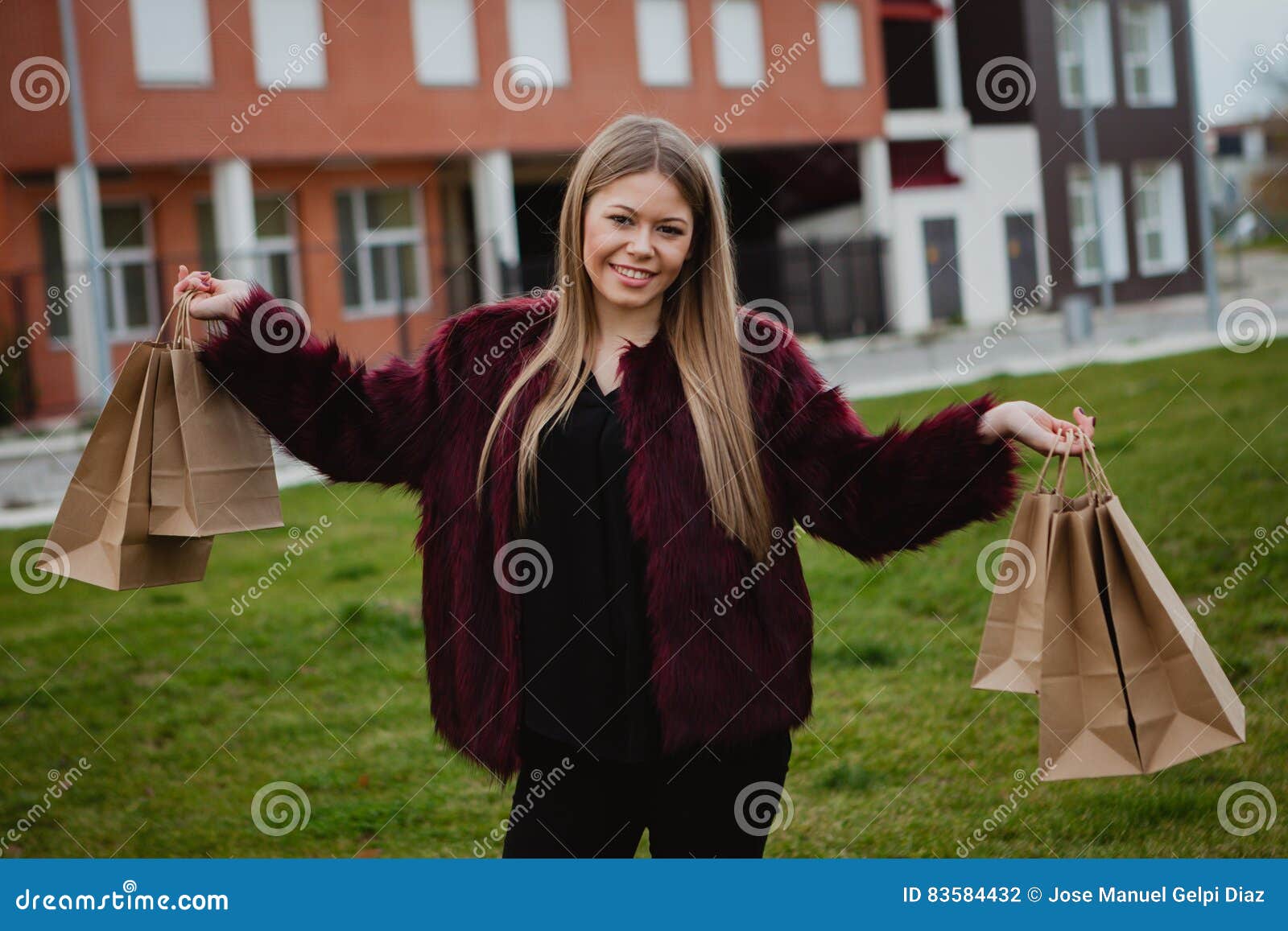 Pretty blond girl shopping. Pretty blond girl with fur coat shopping