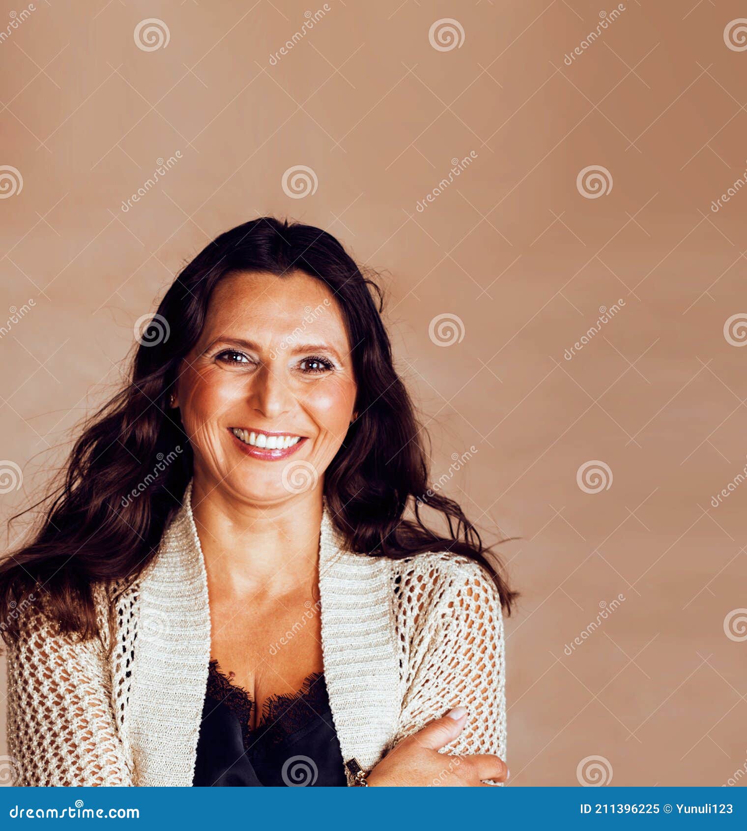 Pretty Brunette Confident Mature Woman Posing Cheerful On Warm Brown