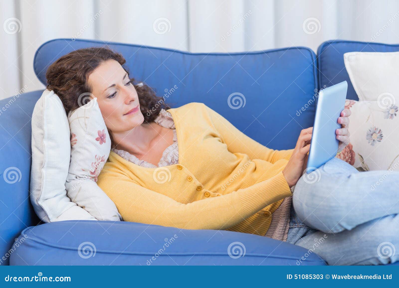 Pretty Brunette Lying On The Couch And Using Tablet Stock Image Image Of Digital Curly 51085303