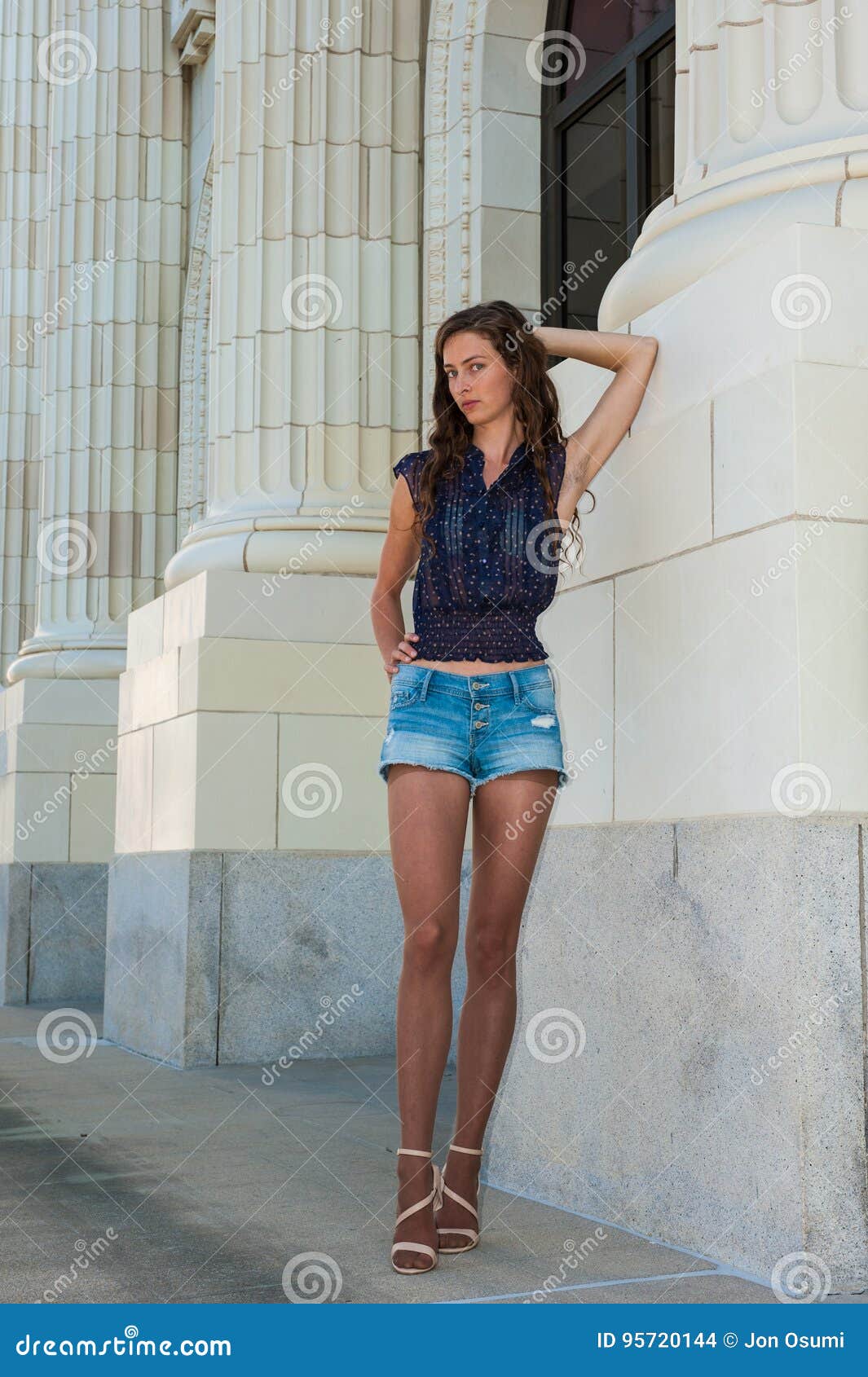 Pretty brunette stock photo. Image of legs, brick, white - 95720144