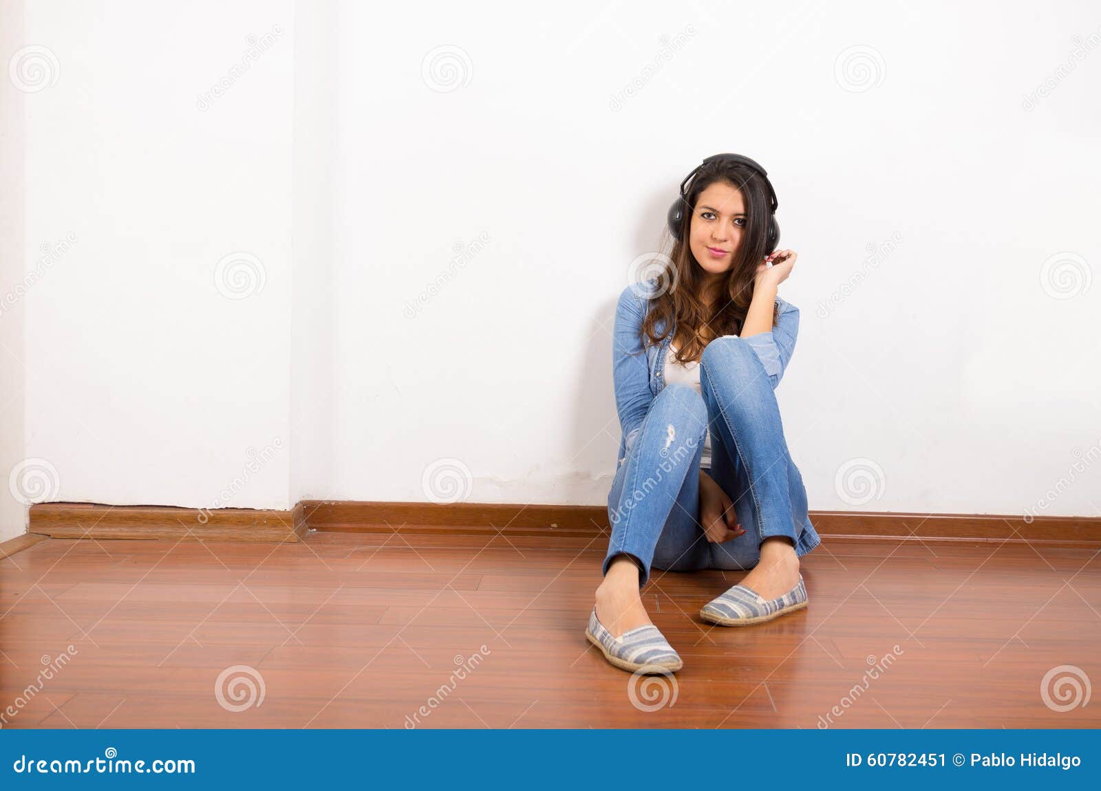 Pretty Brunette Wearing Denim Jeans And Shirt Plus Stock