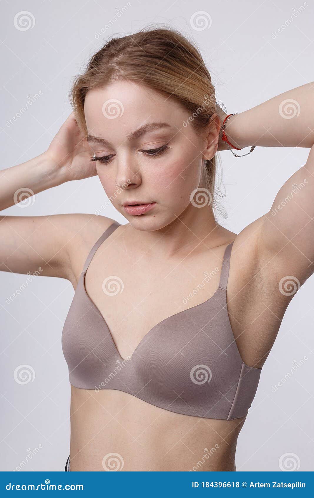 Portrait of young naked lady posing without bra - Stock Photo