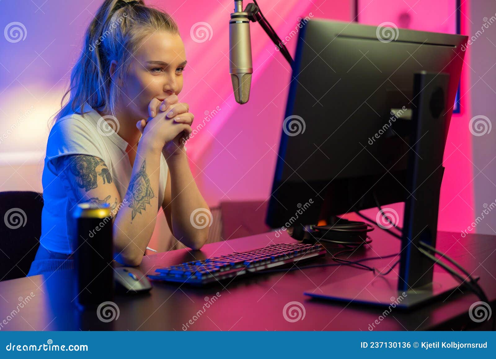 Happy and Beautiful Blonde Gamer Girl Playing Online Video Game on Her  Personal Computer Stock Photo by kjekol