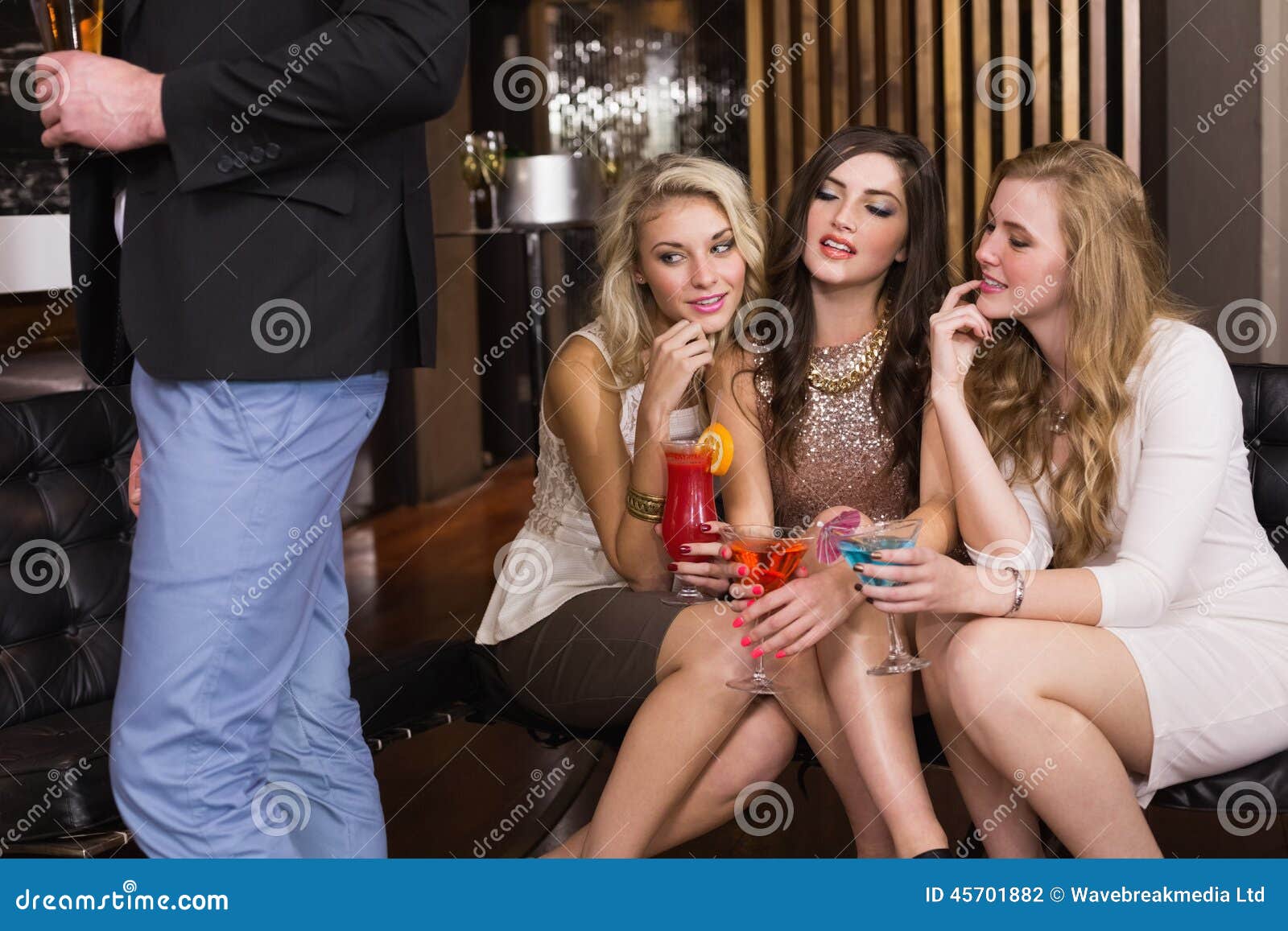 Pretty Friends Checking Out the Boys Stock Photo Image of smiling