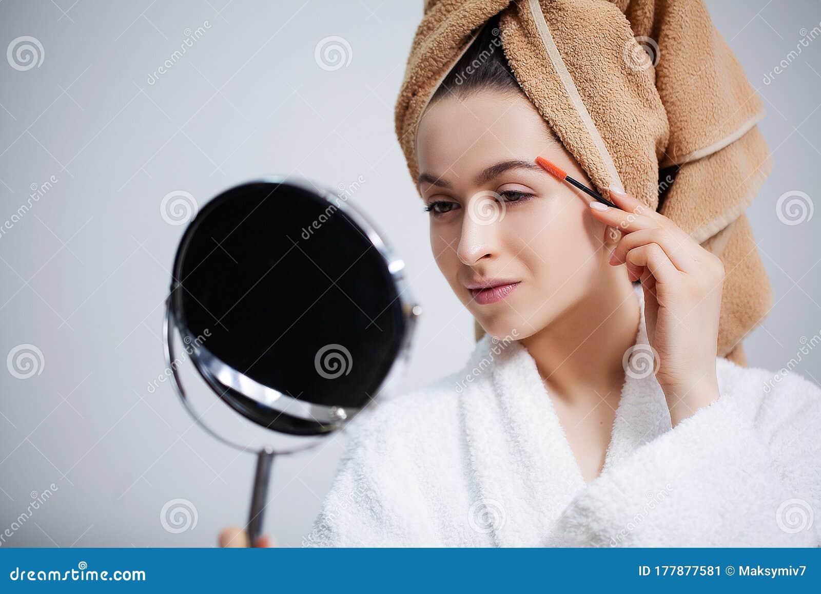 Pretty Girl Doing Cosmetic Procedures at Home in Front of Mirror Stock
