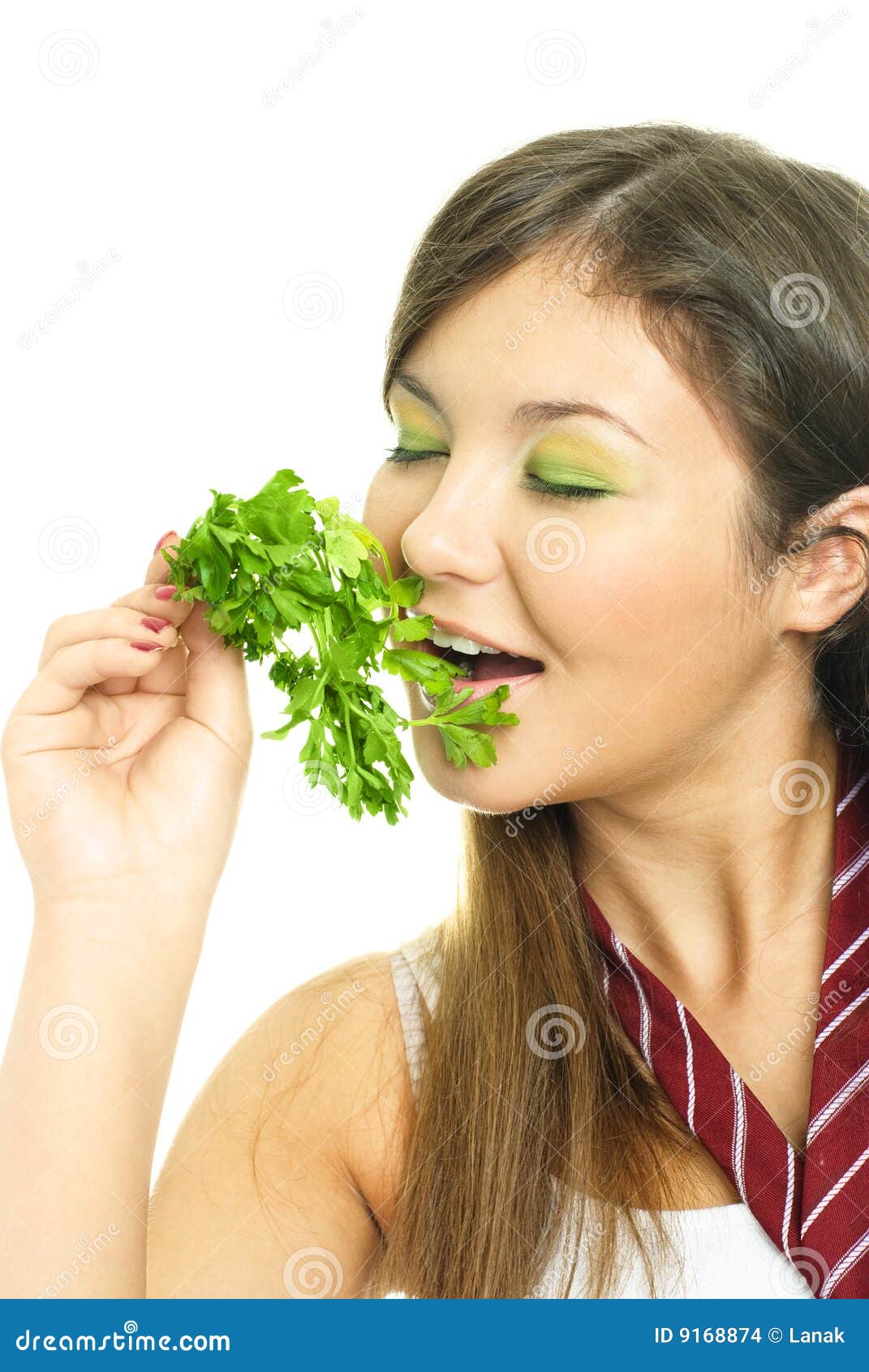 Pretty girl eating parsley stock photo. Image of joyful 9168874