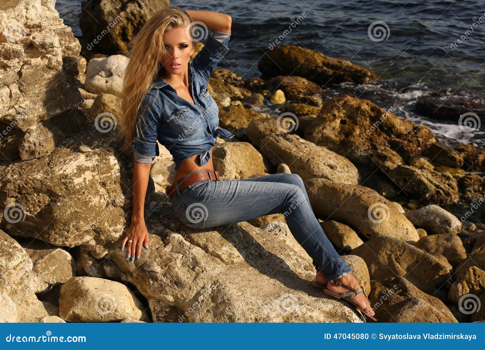 Pretty Girl With Long Blond Hair In Jeans Clothes Posing On Summer