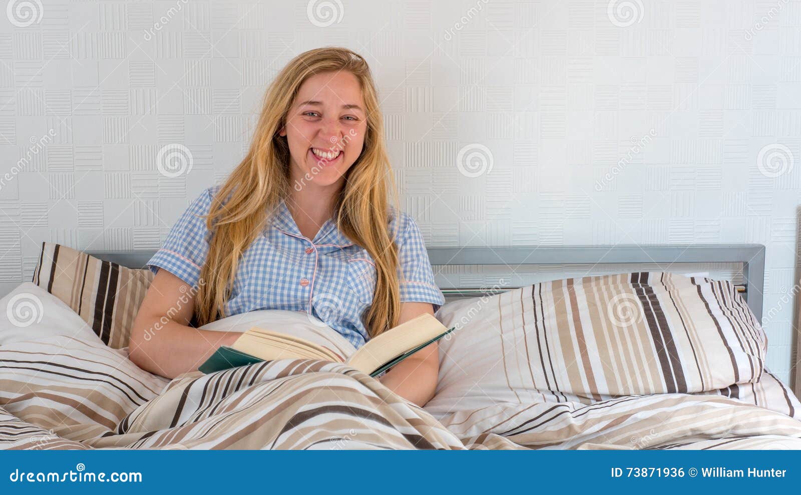 Pretty Girl Reading Book while Lying in Bed Stock Photo Image of