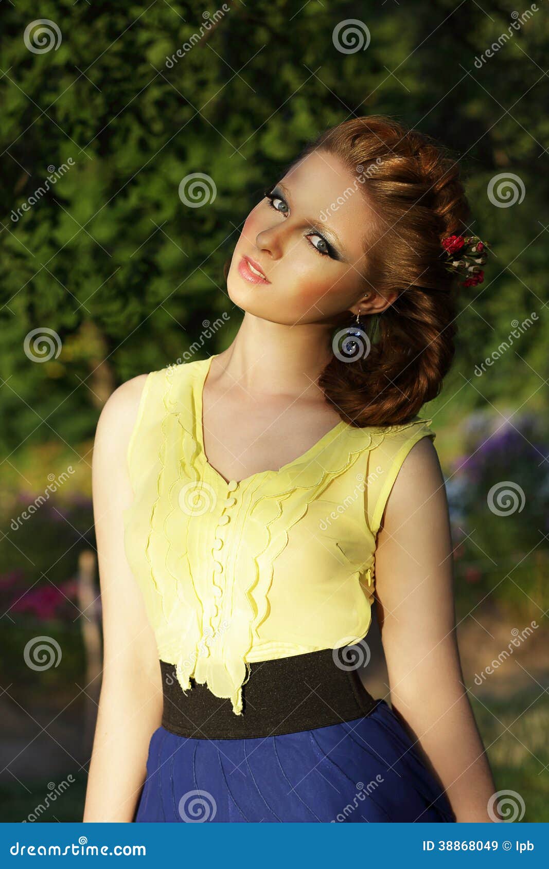 pretty girl in sleeveless sundress outdoors