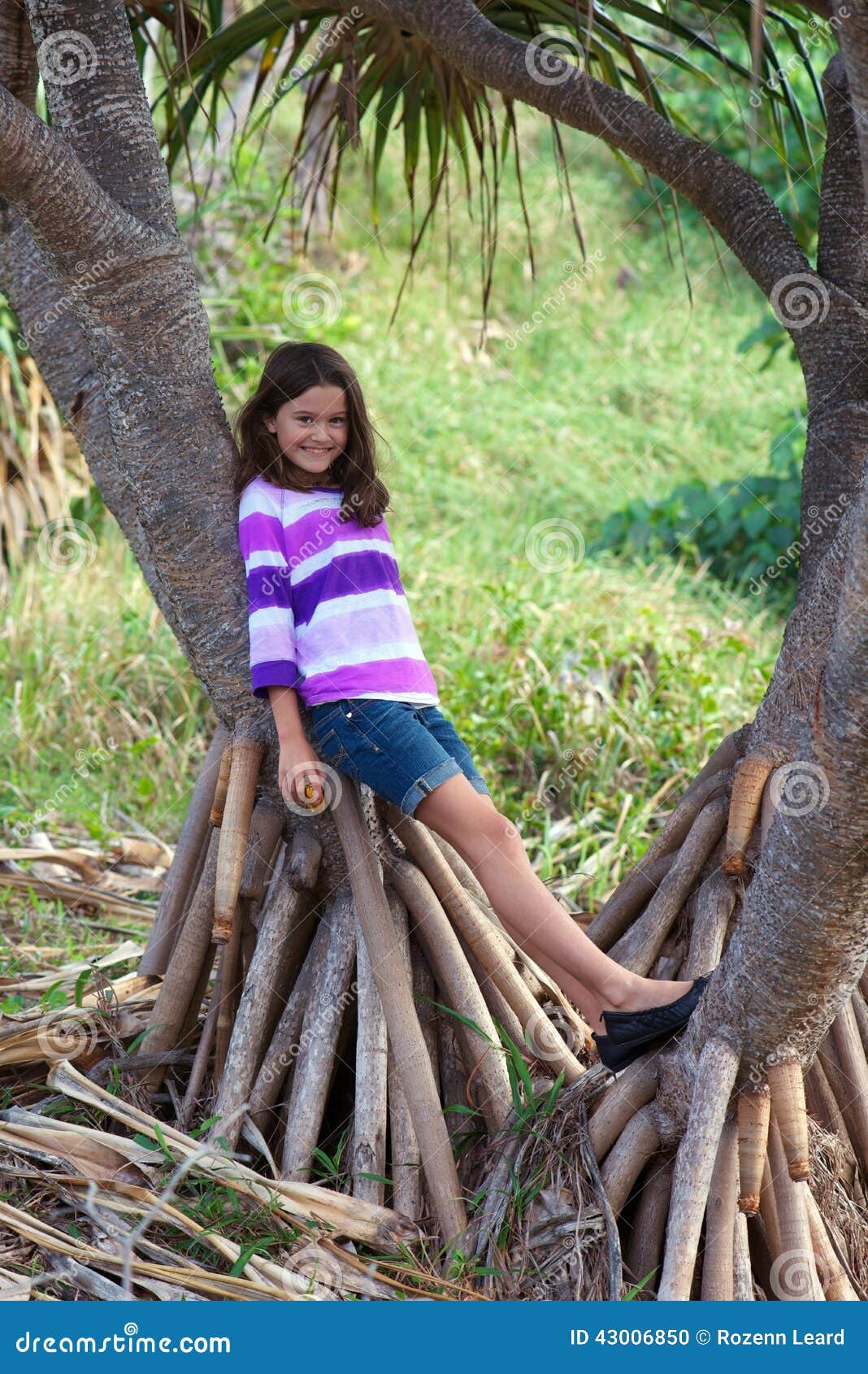 Pretty girl on tree stock photo. Image of against, leaning - 43006850