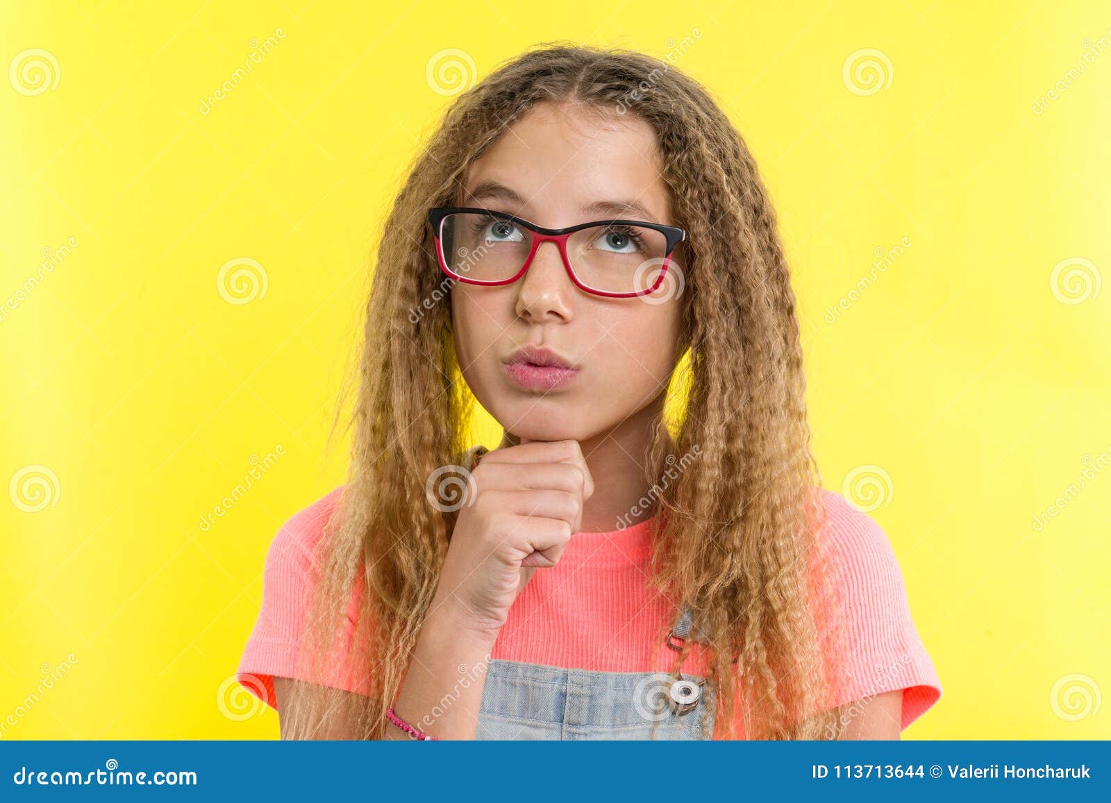 Pretty Girl 12-13 Years Old Blonde with Curly Hair with Glasses, Looks  Pensively Aside, Thinking about School. Facial Expressions Stock Photo -  Image of natural, beautiful: 113713644