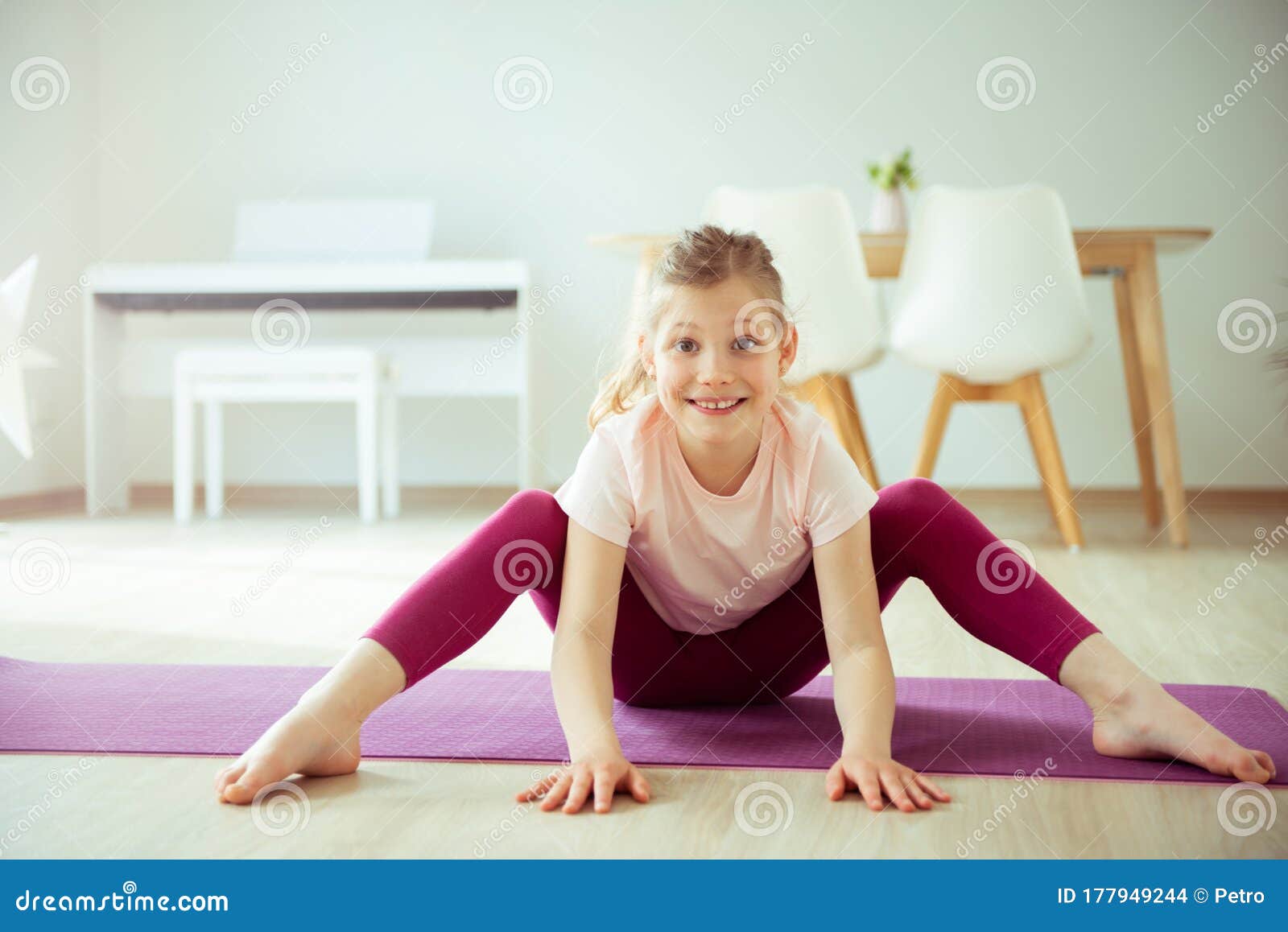 Cute Little Girl Doing Yoga at Home Stock Image - Image of