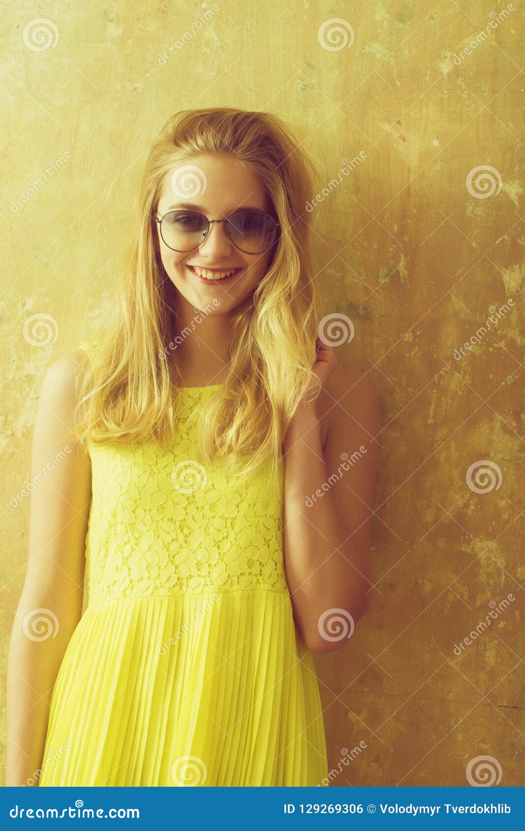 Pretty Happy Girl With Blonde Hair In Yellow Dress Sunglasses