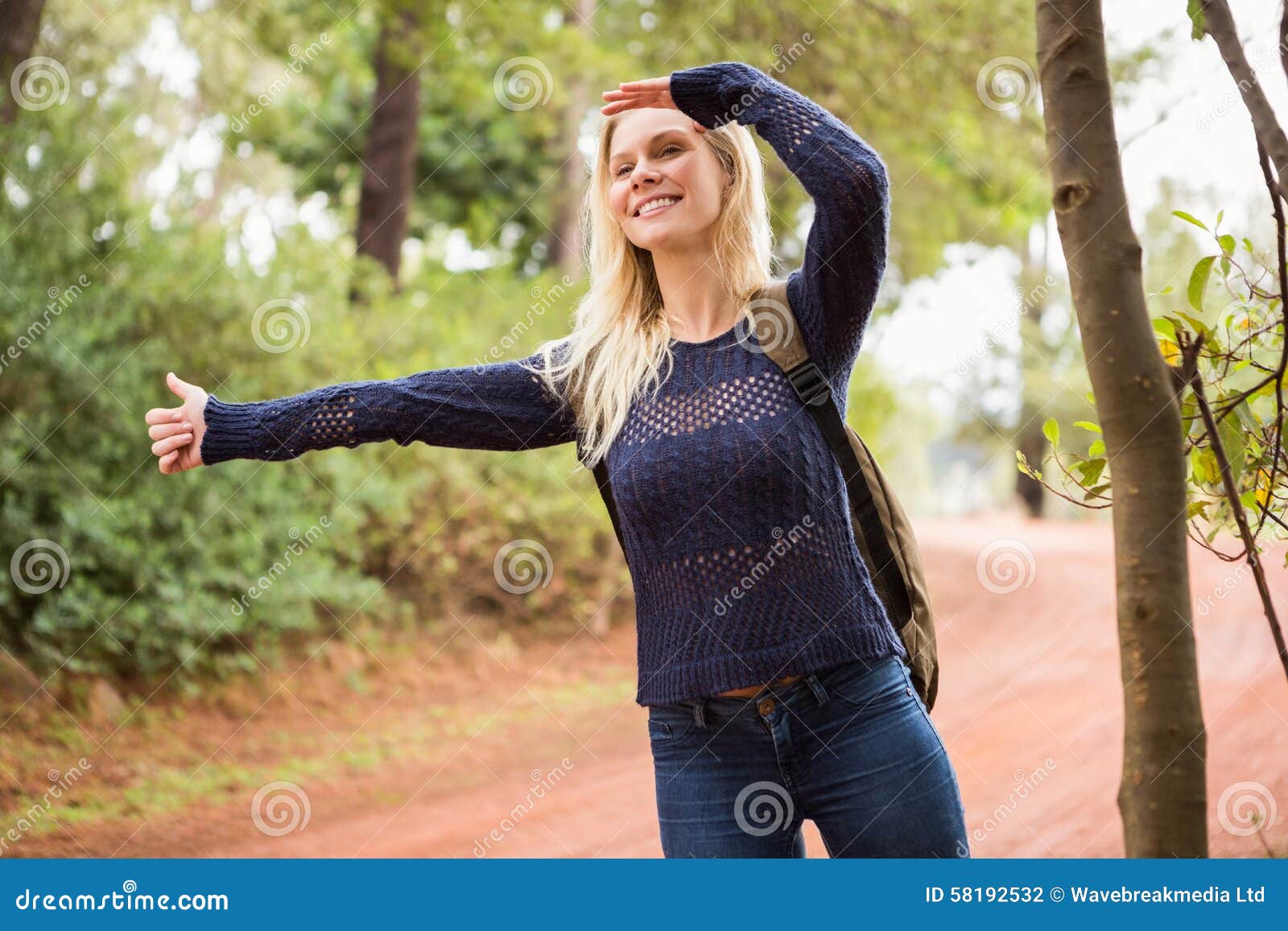 Pretty Hitchhiker Sticking Thumb Out Stock Photo Image of hiker