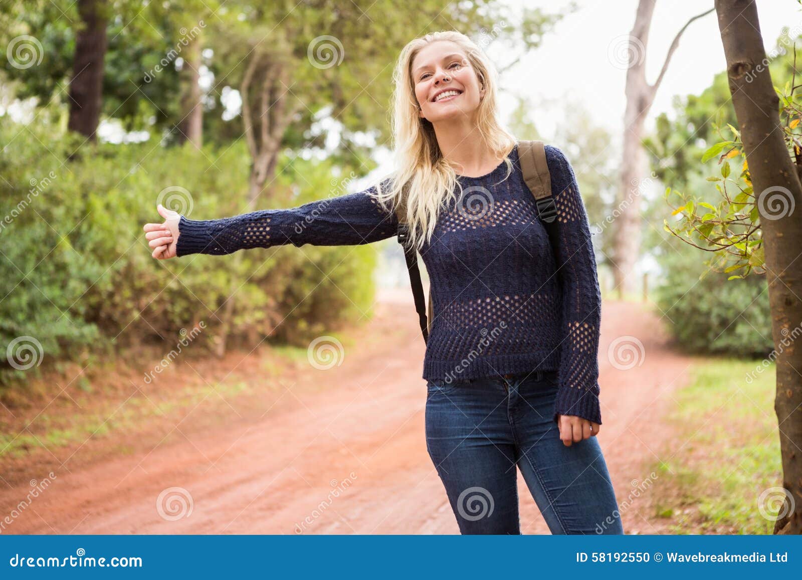 Pretty Hitchhiker Sticking Thumb Out Stock Photo Image of gesturing