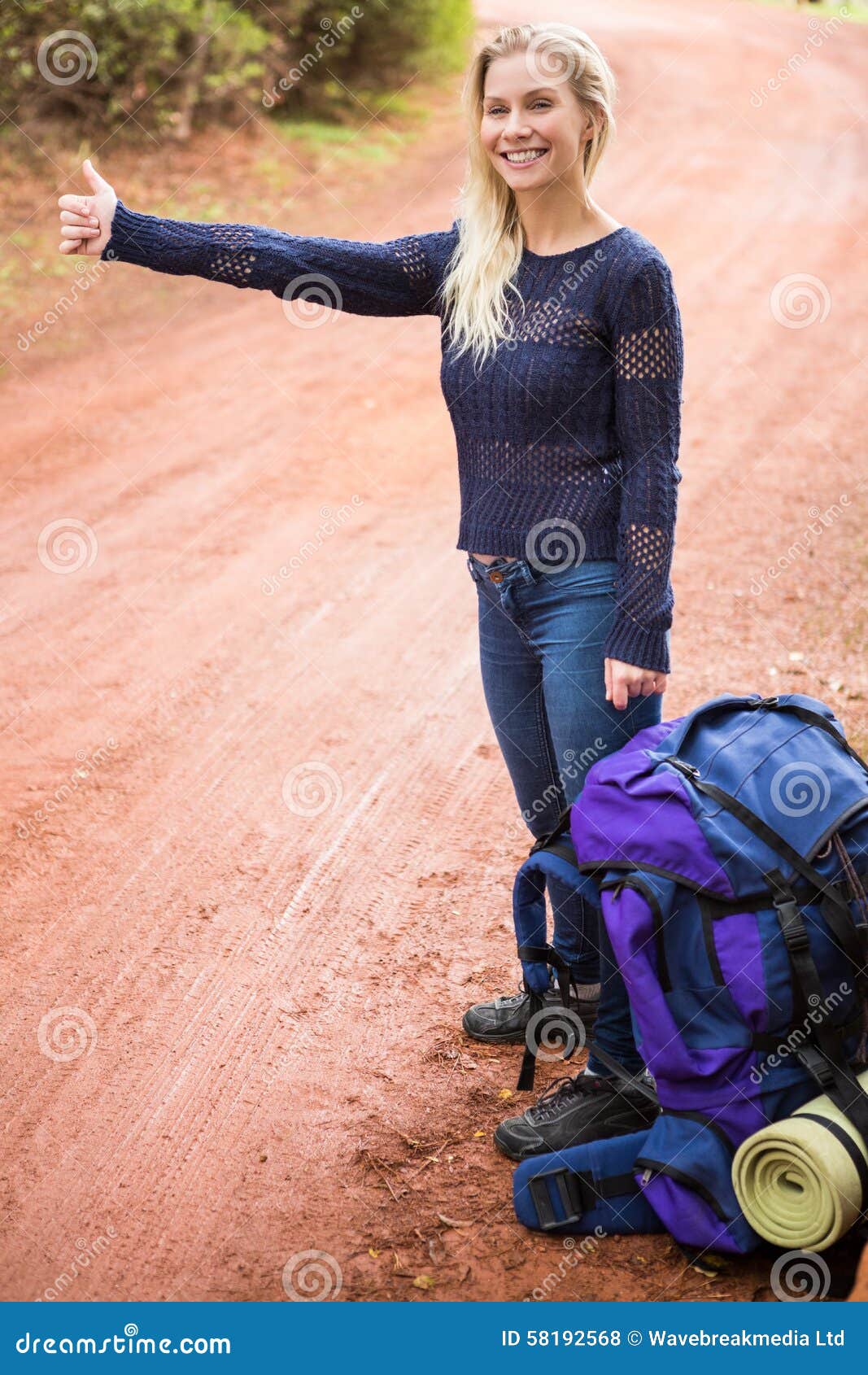 Pretty Hitchhiker Sticking Thumb Out Stock Photo Image of floor