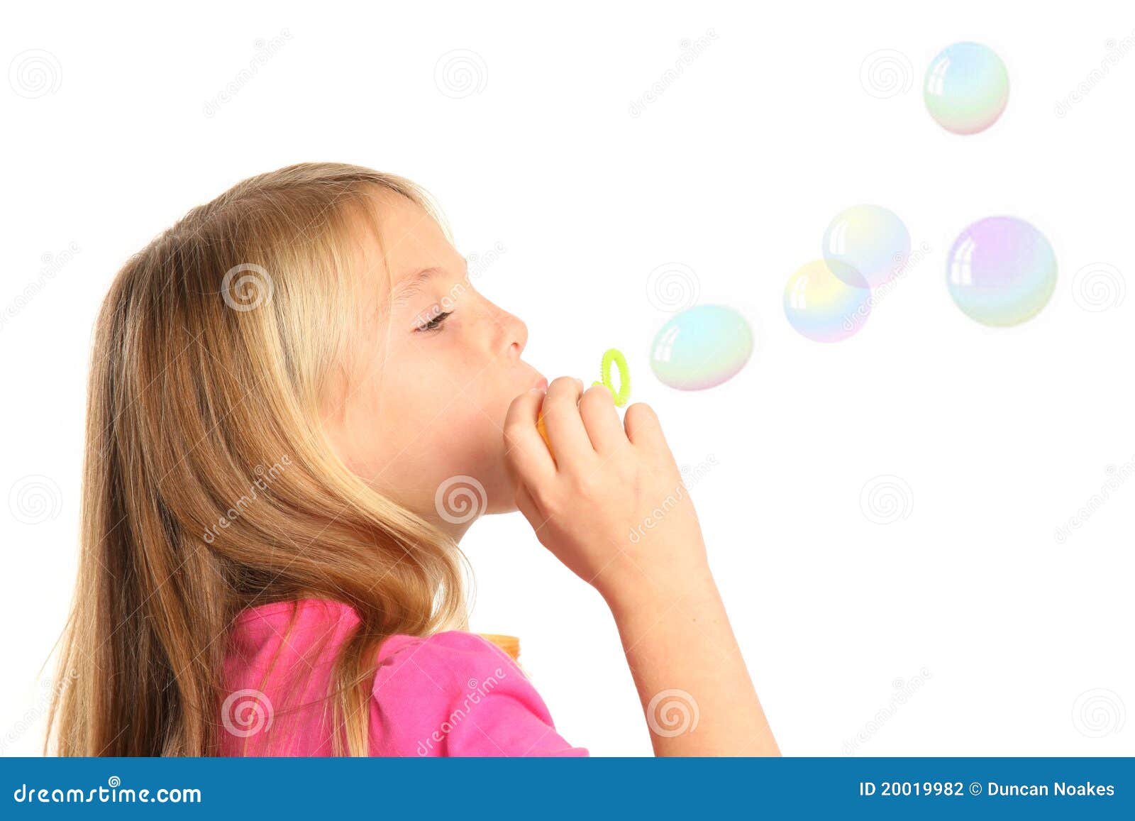 pretty kid blowing bubbles