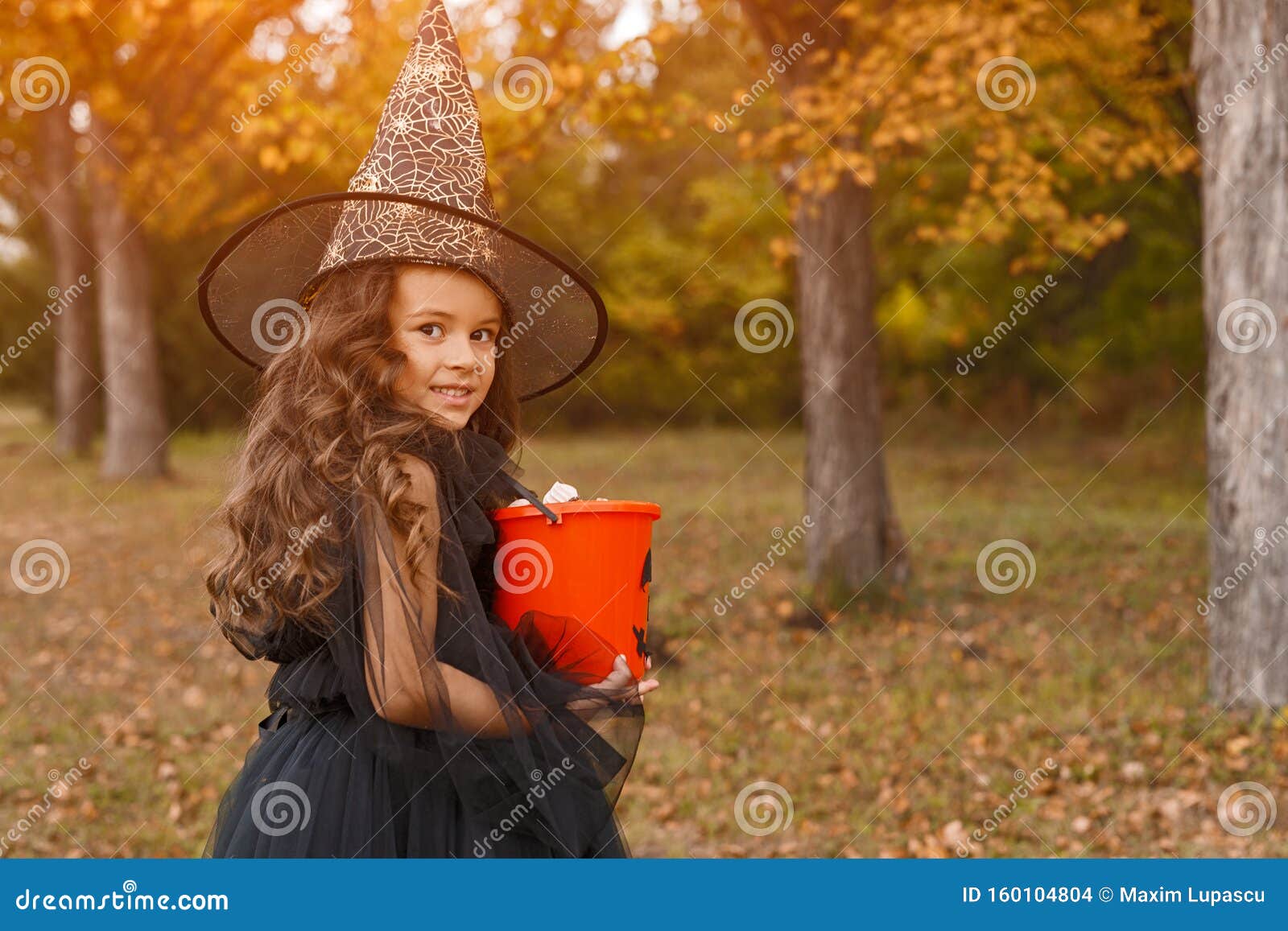 Pretty Little Witch with Jack or Lantern Bucket Stock Photo - Image of ...