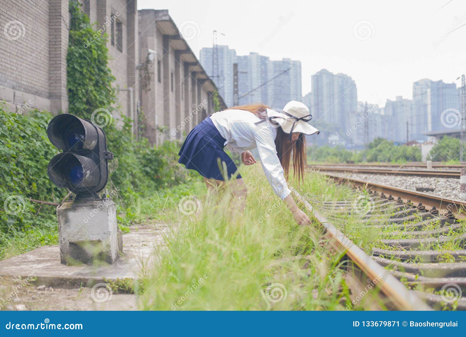 Girl Walking On Rusty Railroad Track Stock Photo 