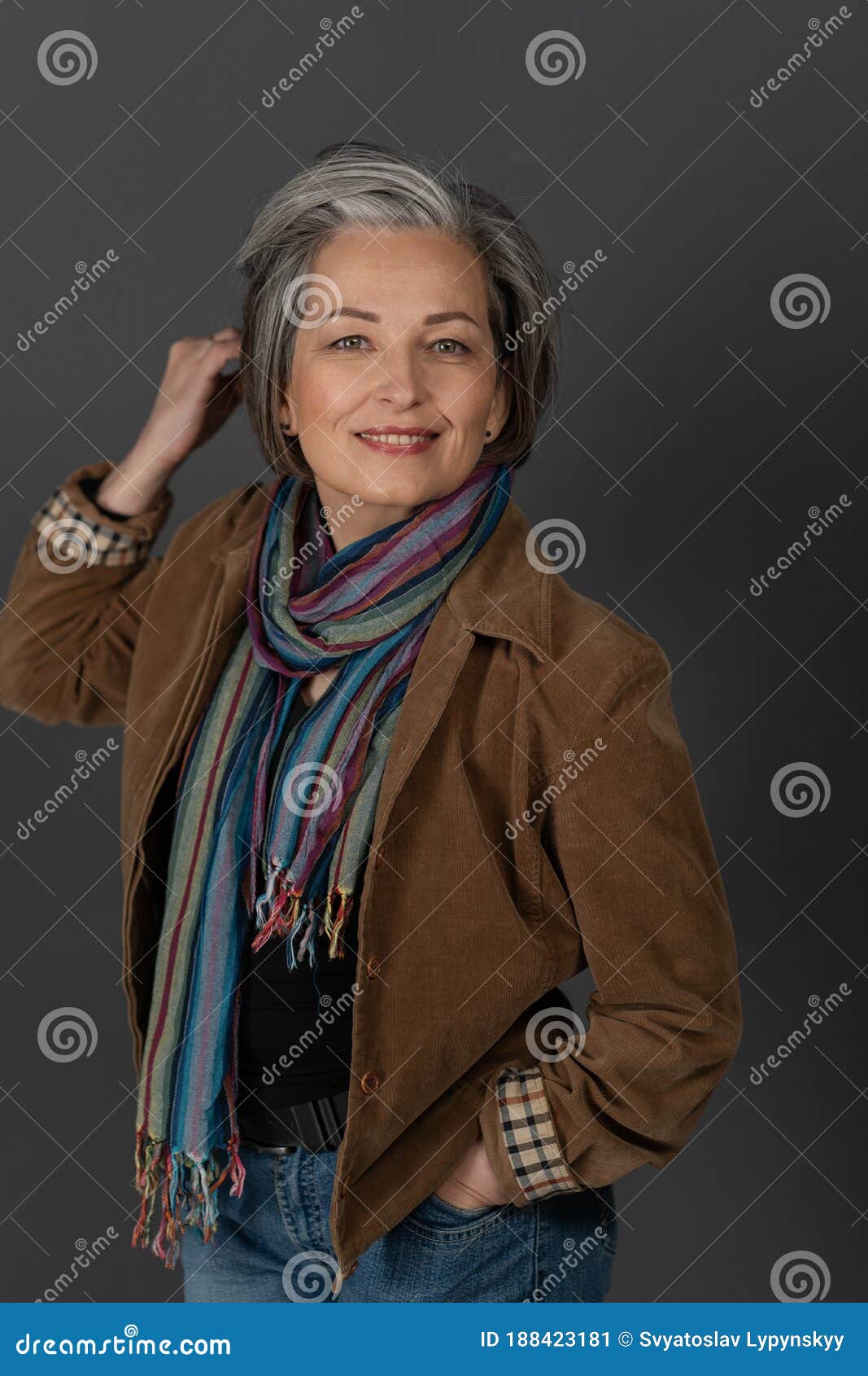 Pretty Mid Aged Woman In Casual. Lady Correct Her Hair With One Hand