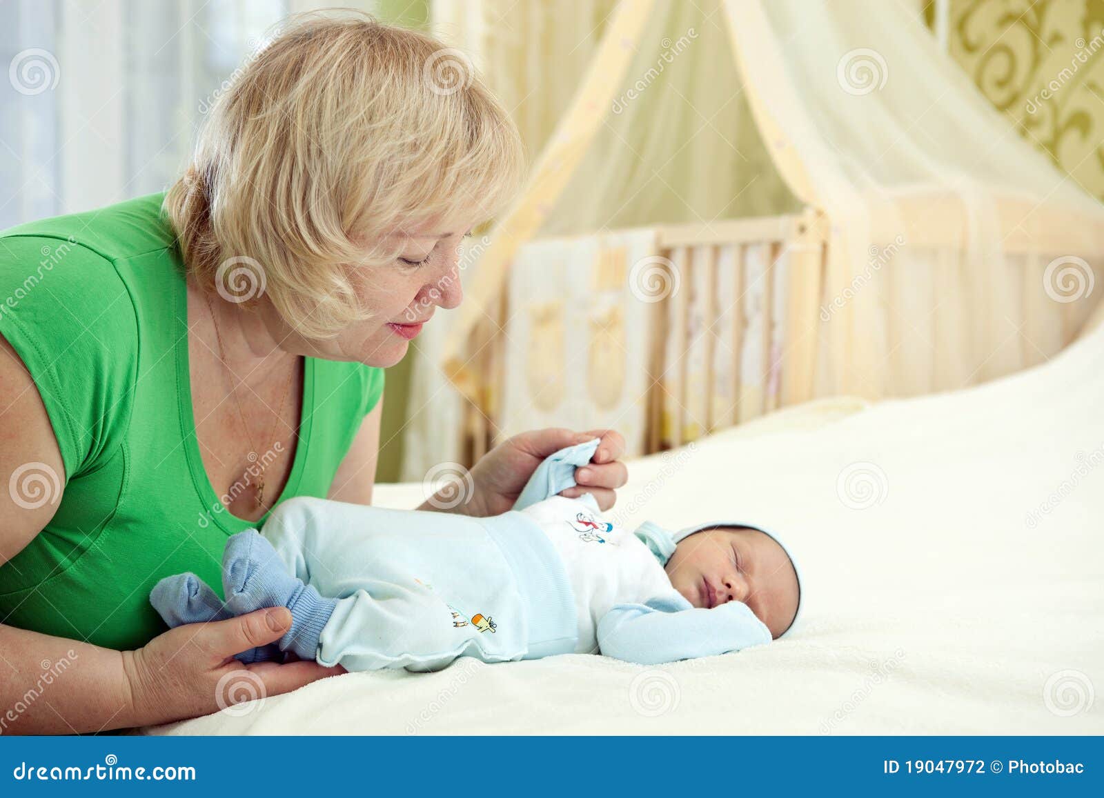 https://thumbs.dreamstime.com/z/pretty-middle-aged-woman-her-newborn-grandson-19047972.jpg