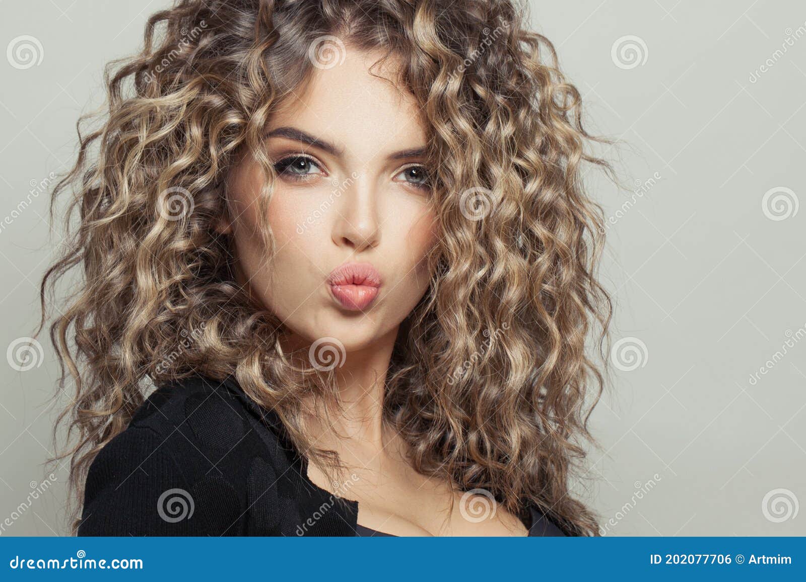 Pretty Model Woman With Healthy Curly Hair On White Background Close