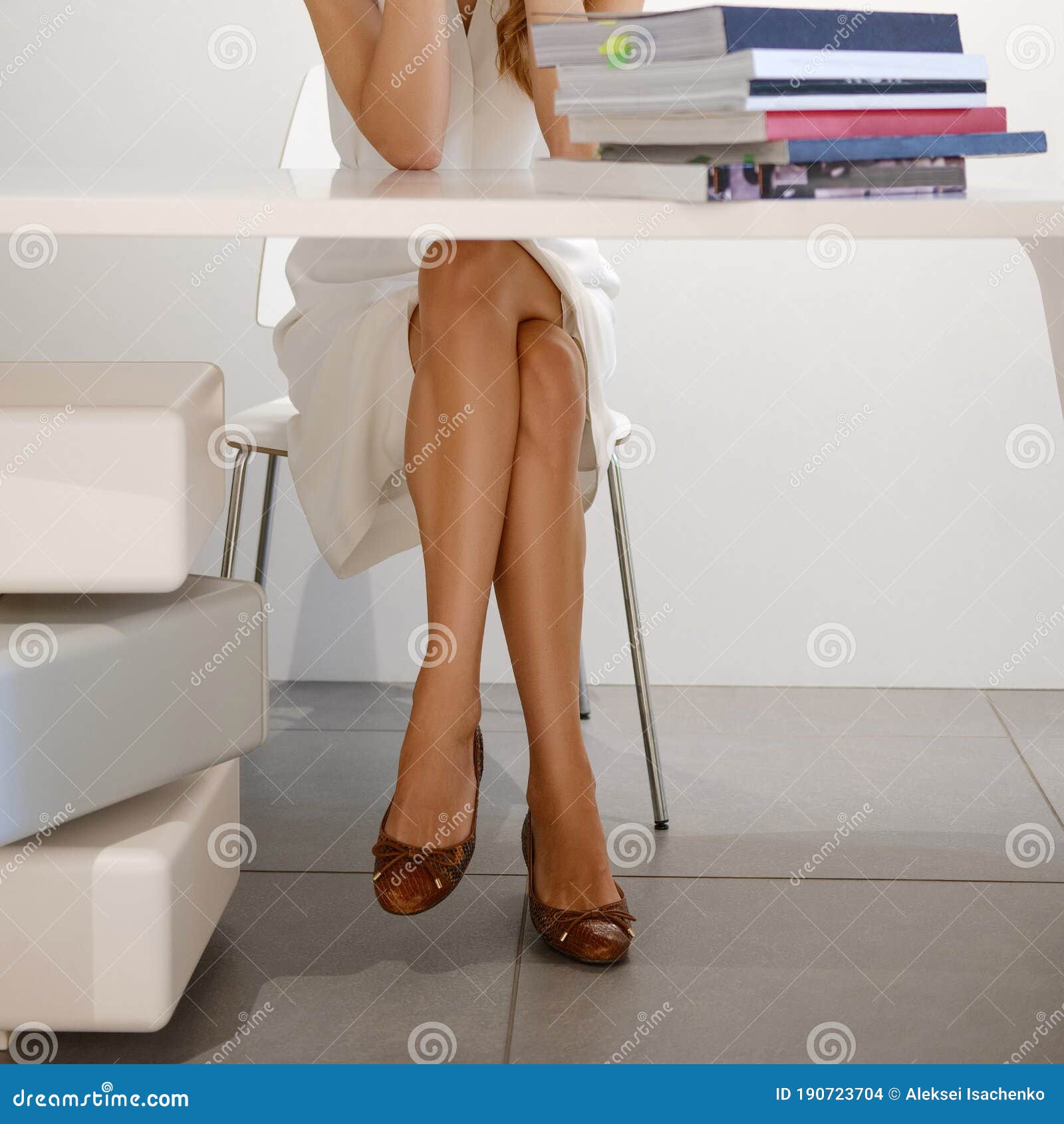 Long Female Legs on Chair in Office Stock Photo - Image of pretty, female:  190723704