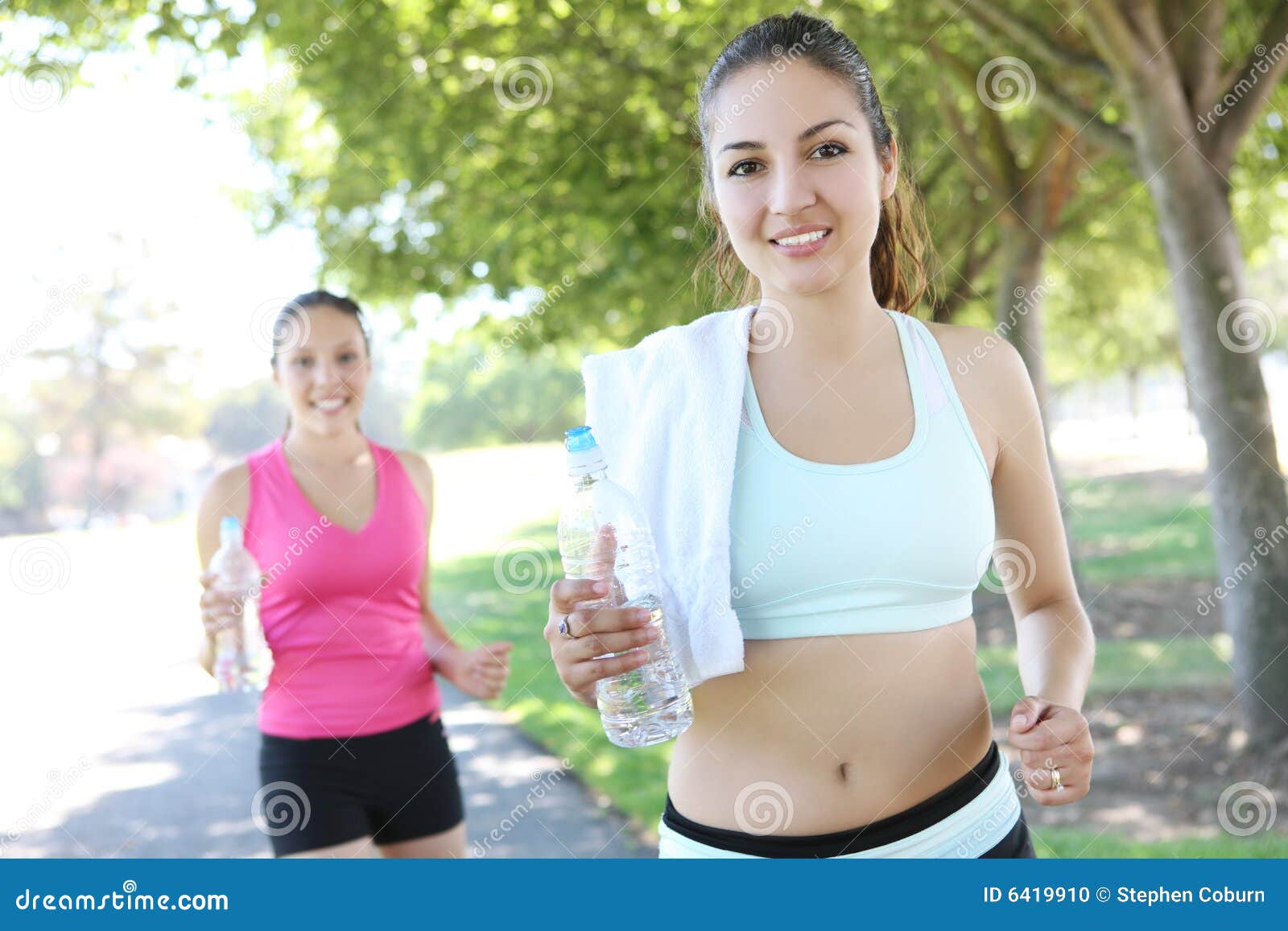 Pretty Sisters Jogging in Park Stock Photo - Image of female, ground ...