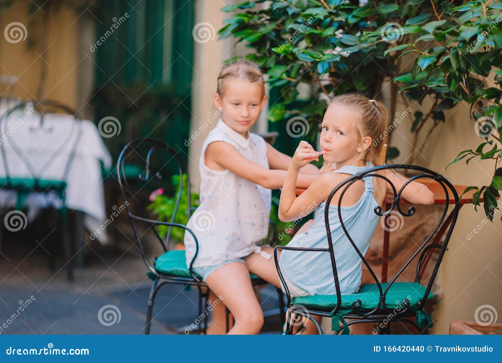 pretty smiling little girls with shopping bags