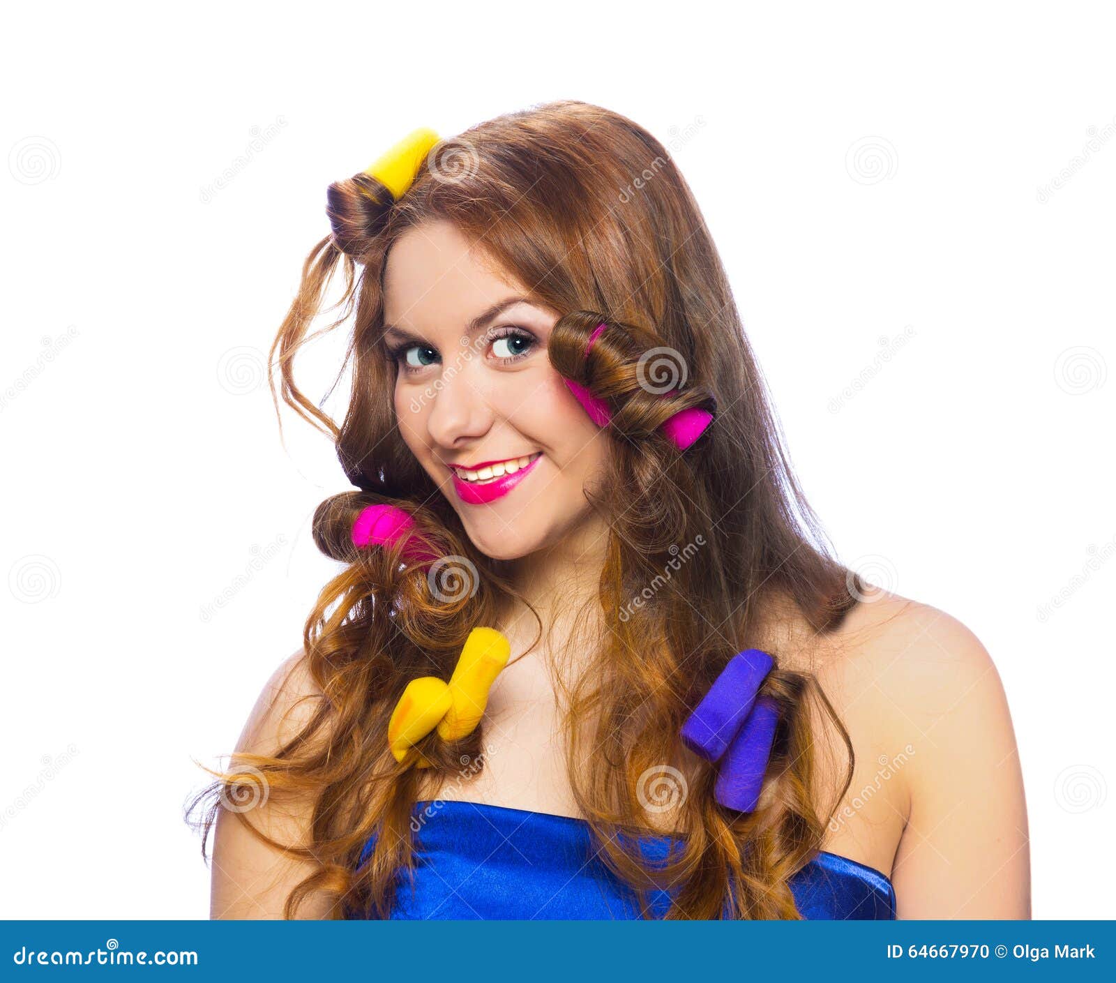 Pretty smiling woman in colorful curlers isolated on white background