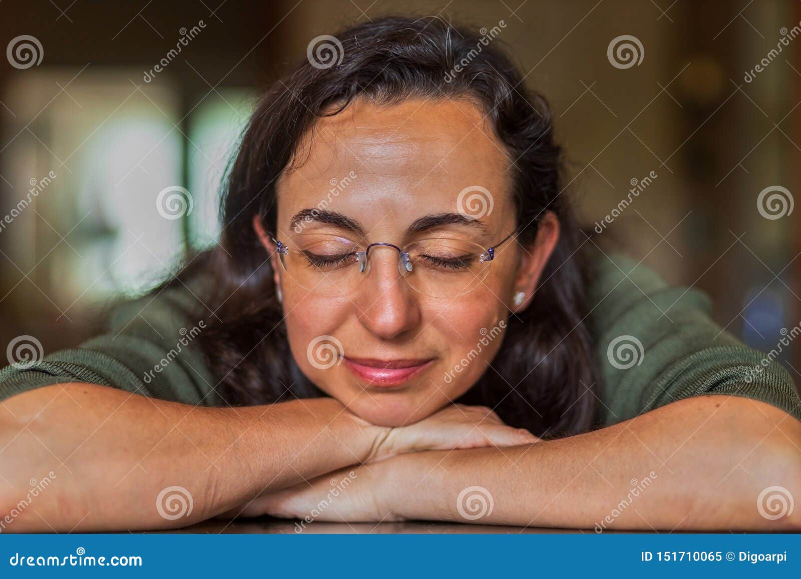 Pretty Spanish Woman with Glasses at Home in Front of the Camera Stock