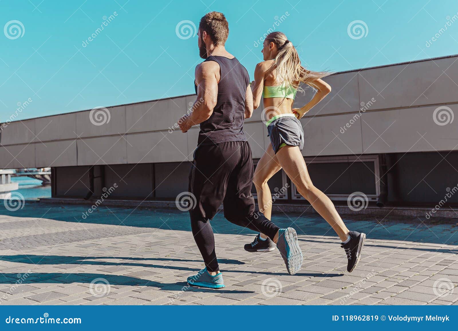 Pretty Sporty Woman and Man Jogging at City Stock Image - Image of ...