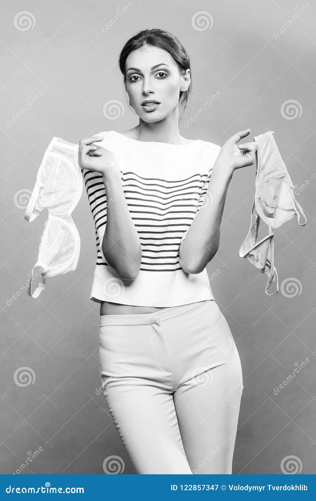 https://thumbs.dreamstime.com/z/pretty-stylish-woman-bra-studio-young-girl-glamour-makeup-face-striped-fashionable-cloth-slim-sexy-body-choosing-122857347.jpg